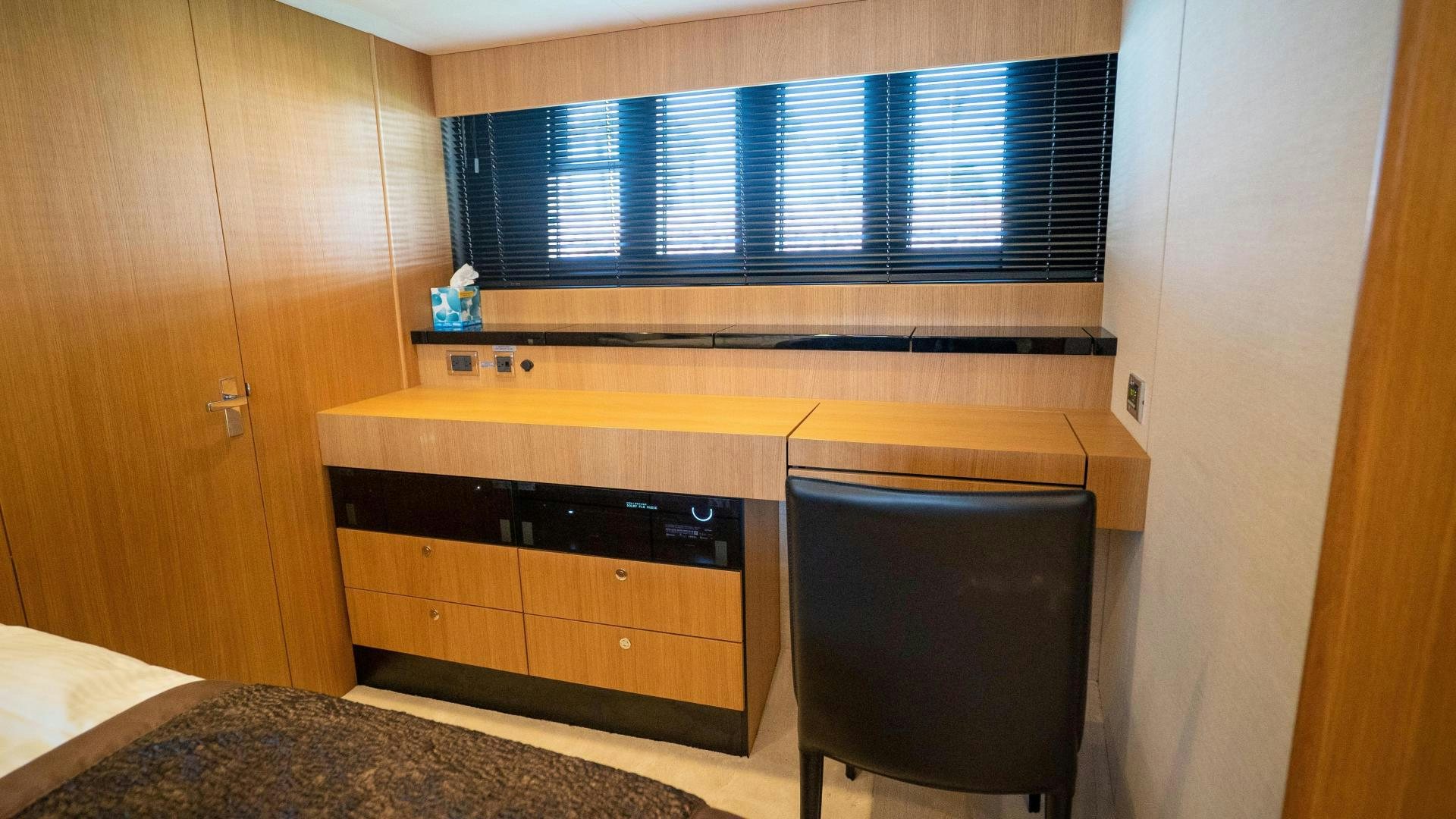 a room with a computer and a desk aboard OCHO UNO Yacht for Sale