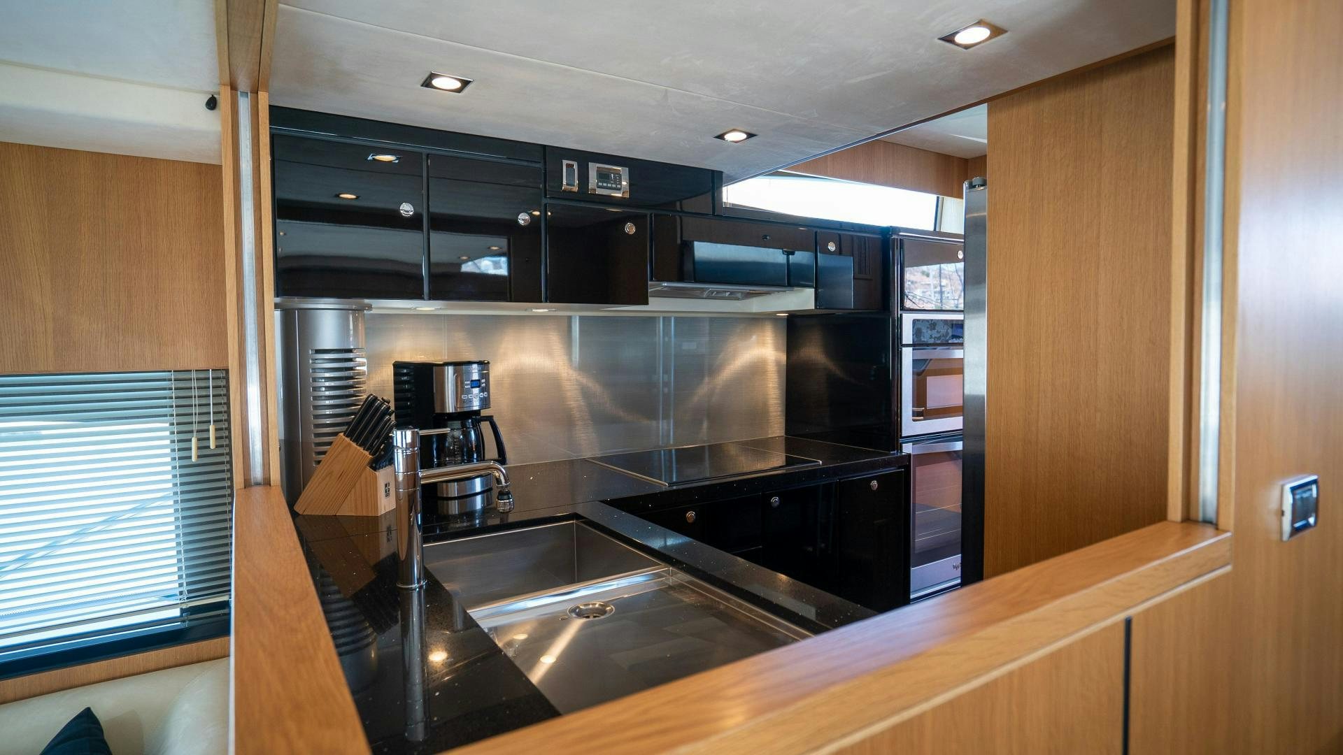 a kitchen with a large counter aboard OCHO UNO Yacht for Sale