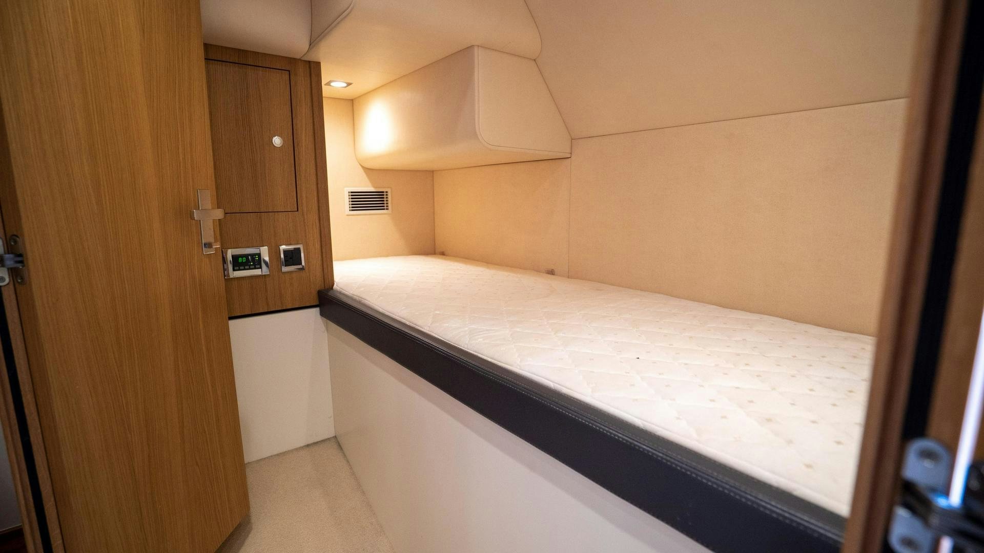 a room with a bed and a closet aboard OCHO UNO Yacht for Sale