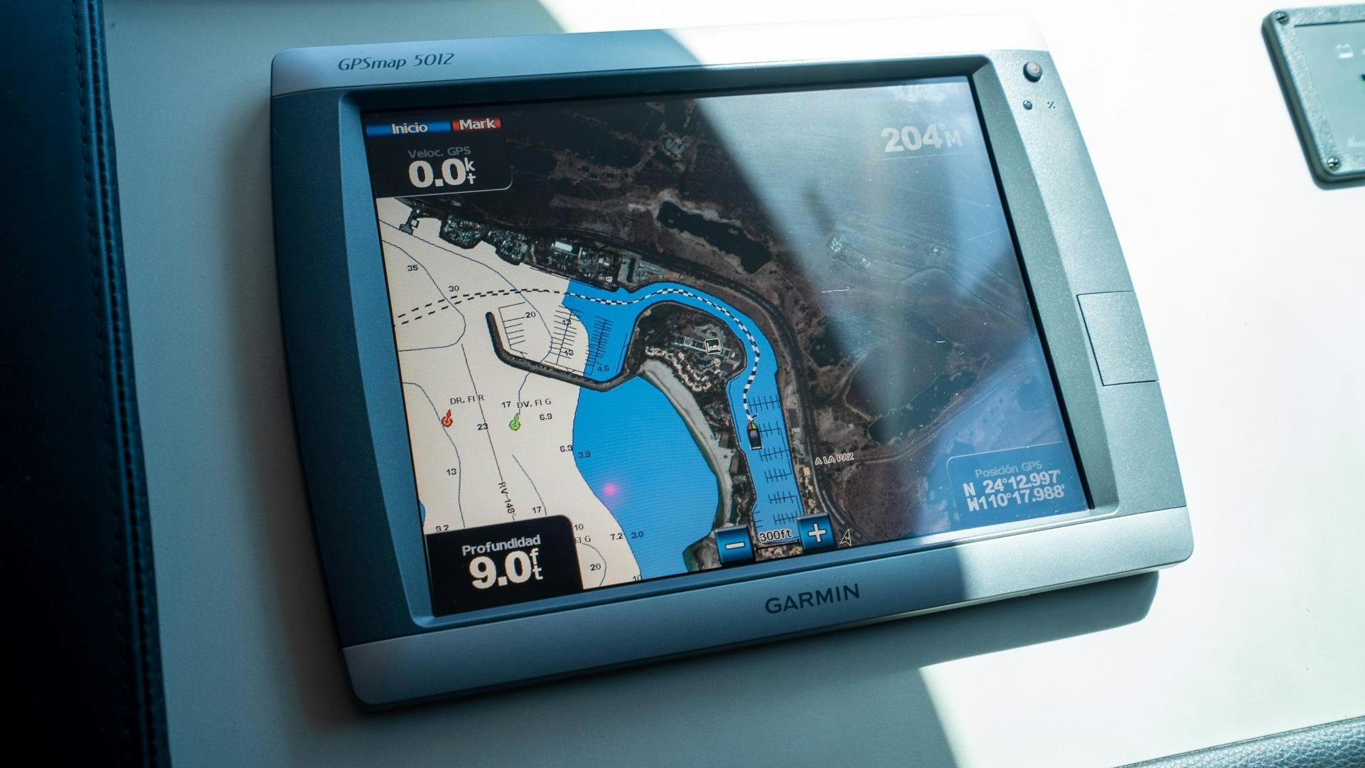 a tablet with a map on the screen aboard OCHO UNO Yacht for Sale