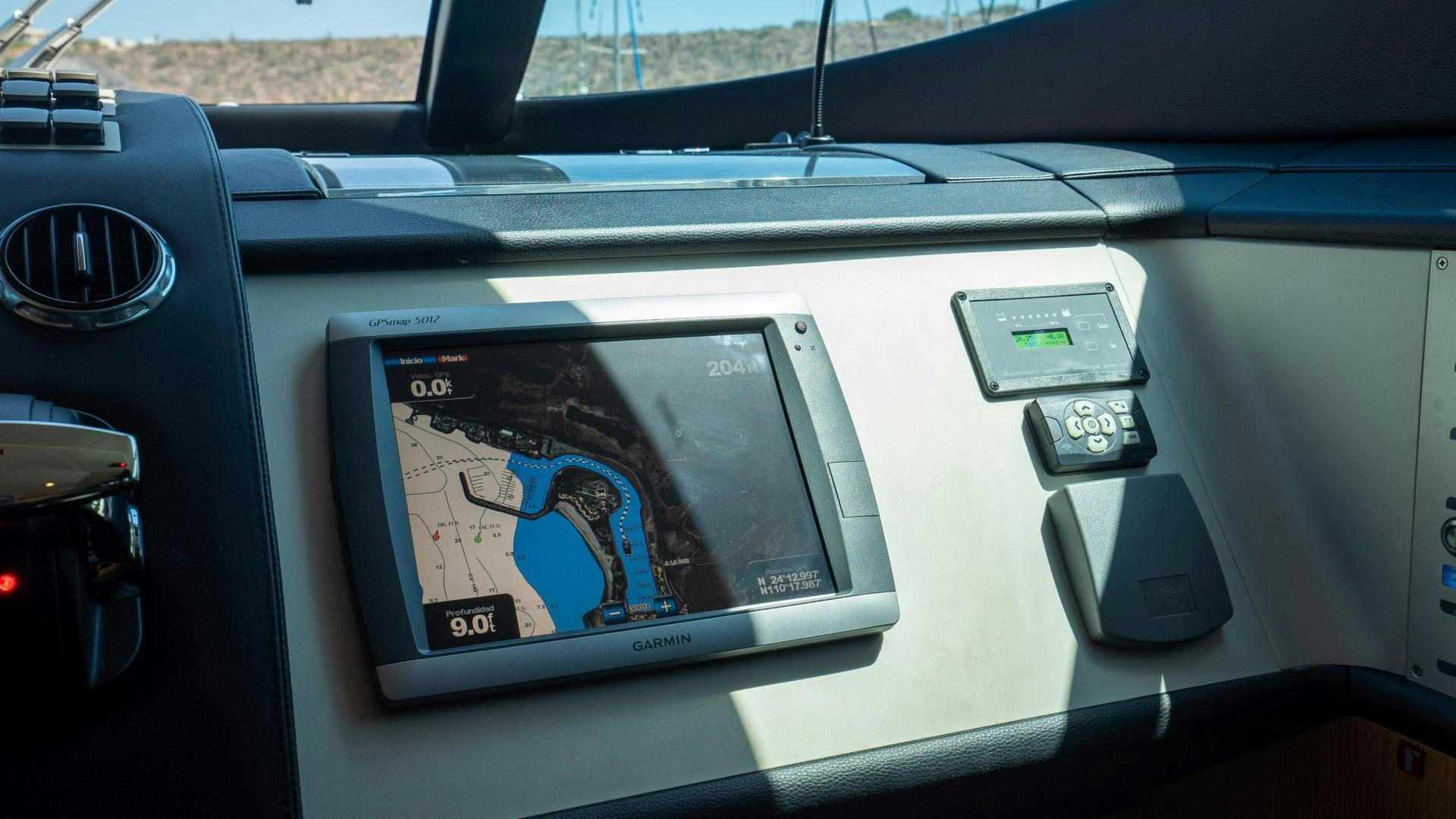 a car with a screen and a picture on the side aboard OCHO UNO Yacht for Sale