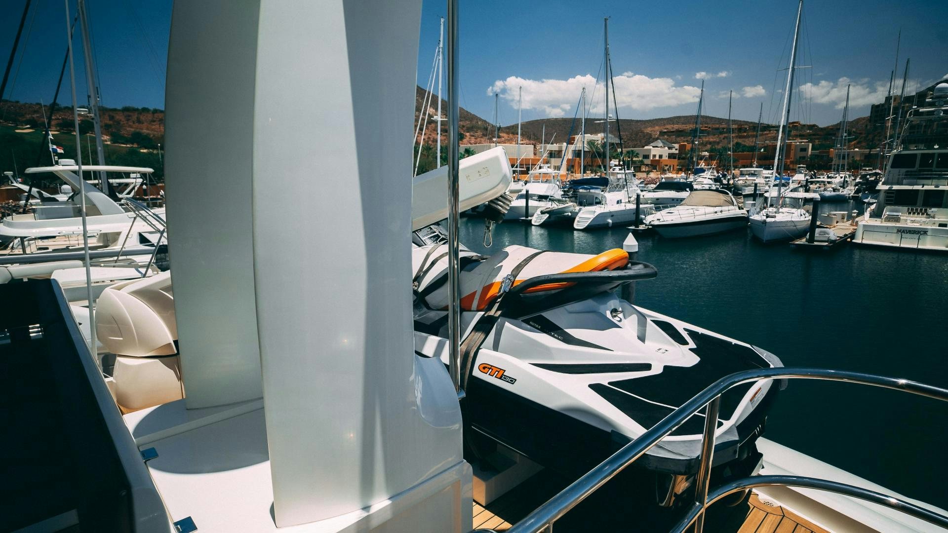 a group of boats are parked in a harbor aboard OCHO UNO Yacht for Sale