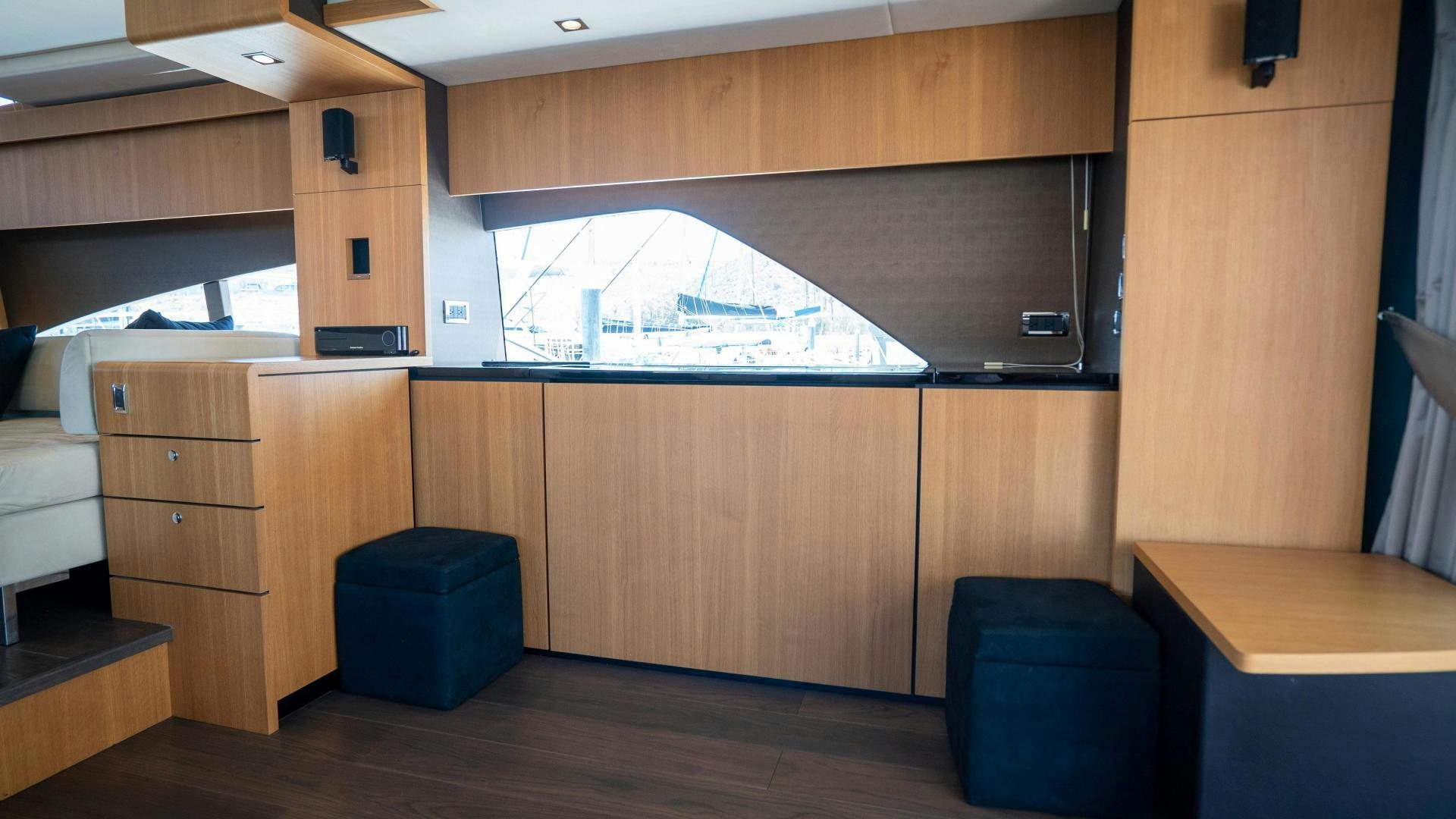 a room with a desk and a window aboard OCHO UNO Yacht for Sale