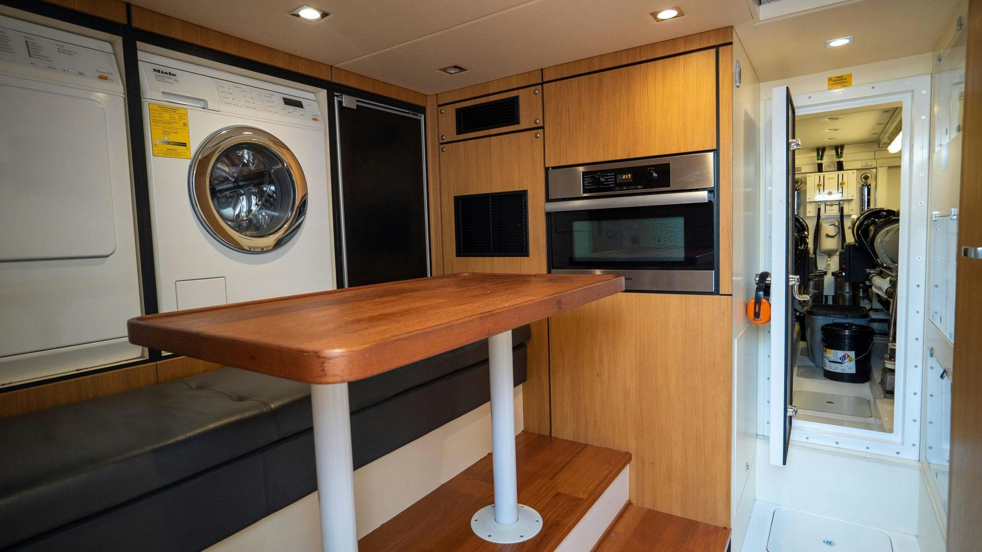 a table in a room aboard OCHO UNO Yacht for Sale