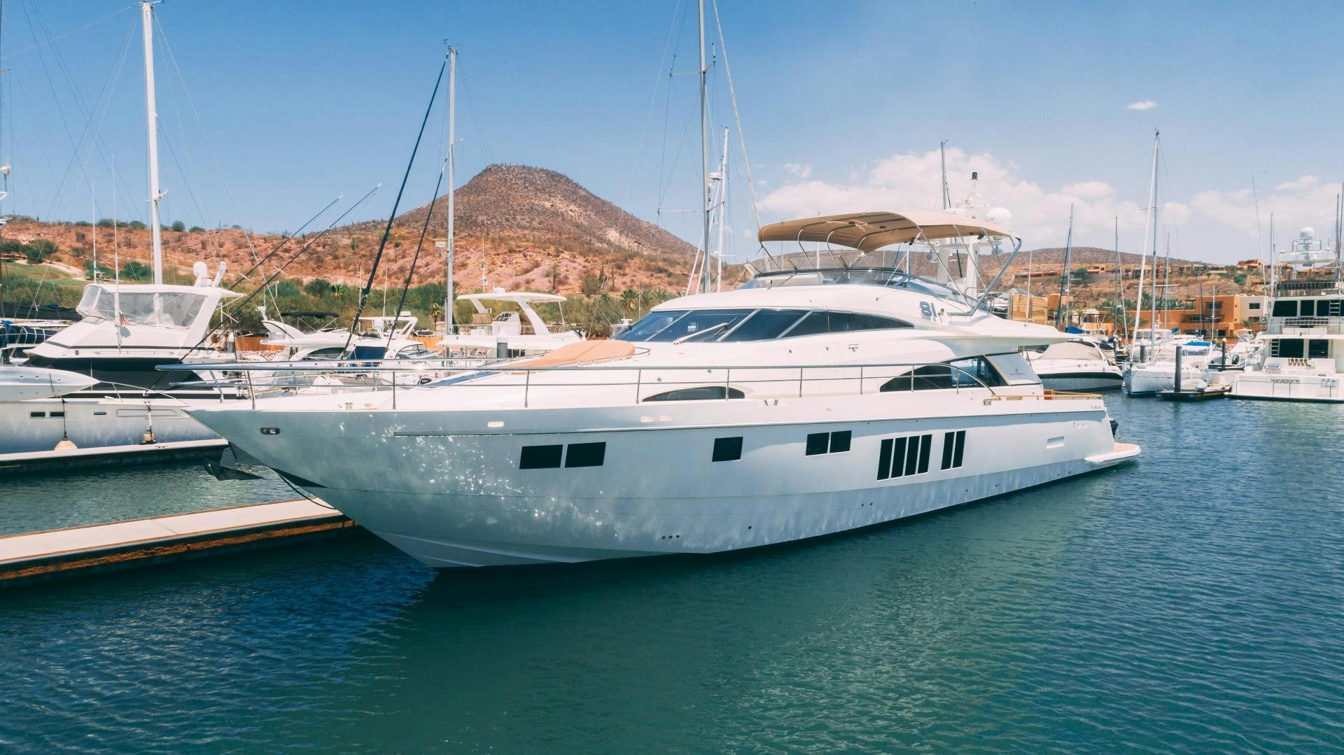 a group of boats in a harbor aboard OCHO UNO Yacht for Sale