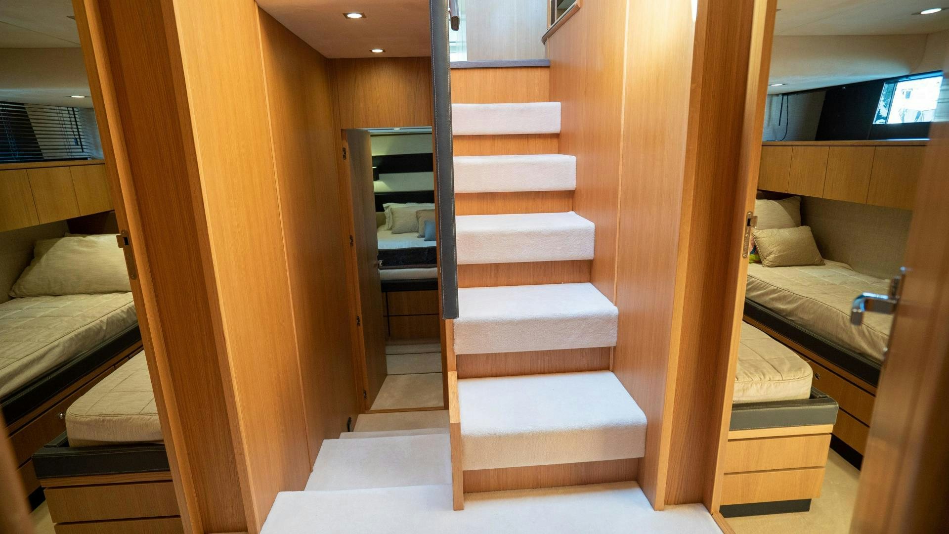 a room with a bed and a couch aboard OCHO UNO Yacht for Sale