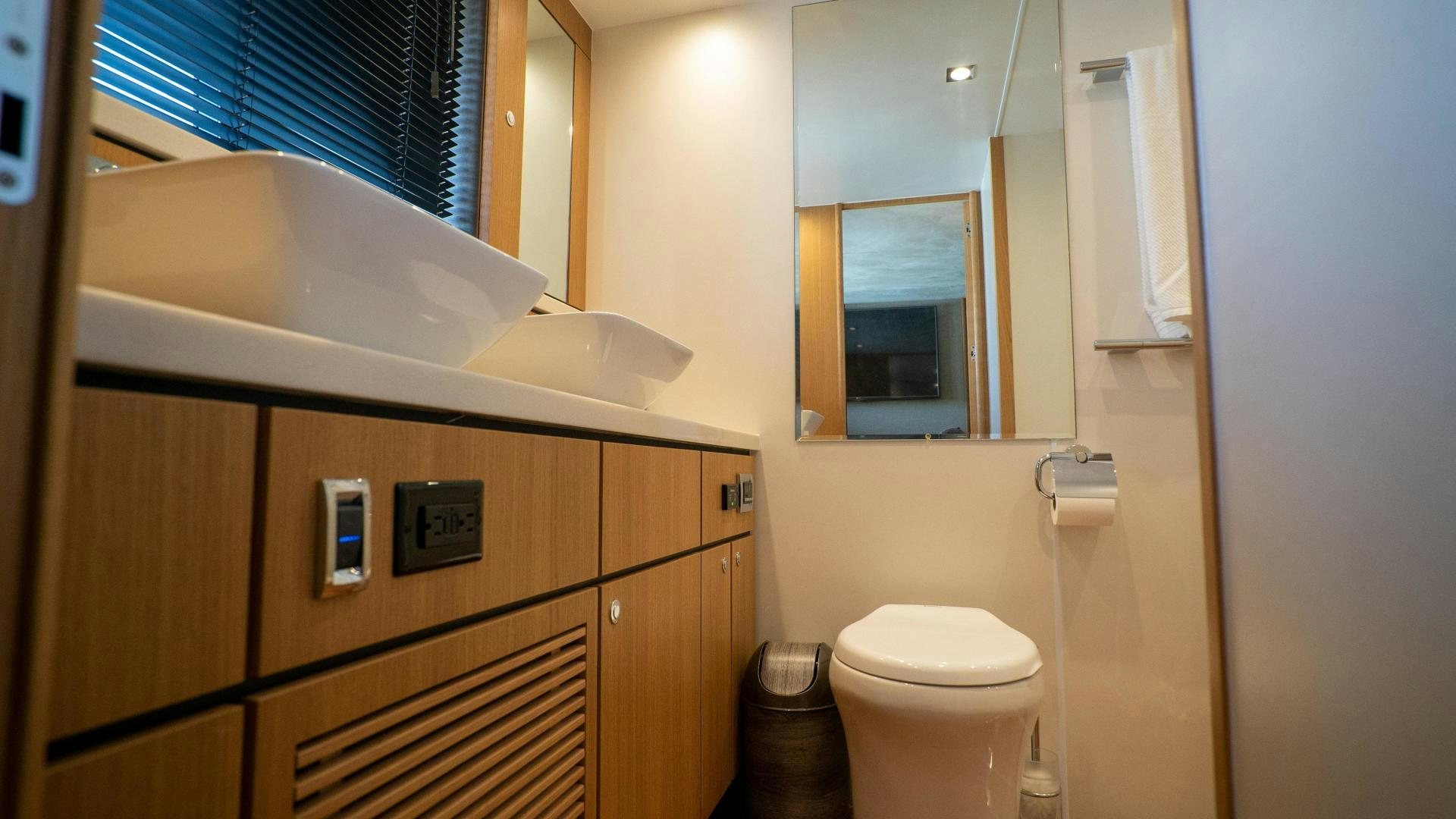 a bathroom with a toilet and a sink aboard OCHO UNO Yacht for Sale
