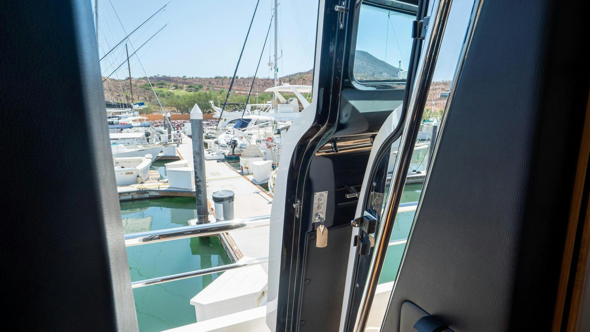 a boat is parked in a harbor aboard OCHO UNO Yacht for Sale