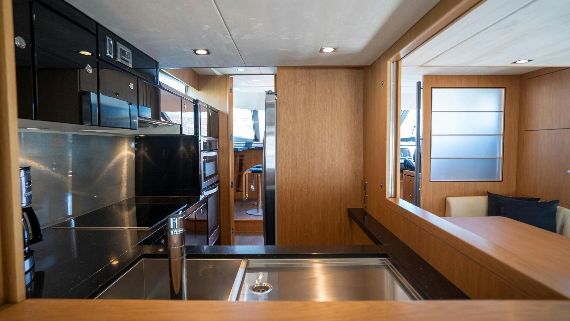 a room with a bed and a table aboard OCHO UNO Yacht for Sale