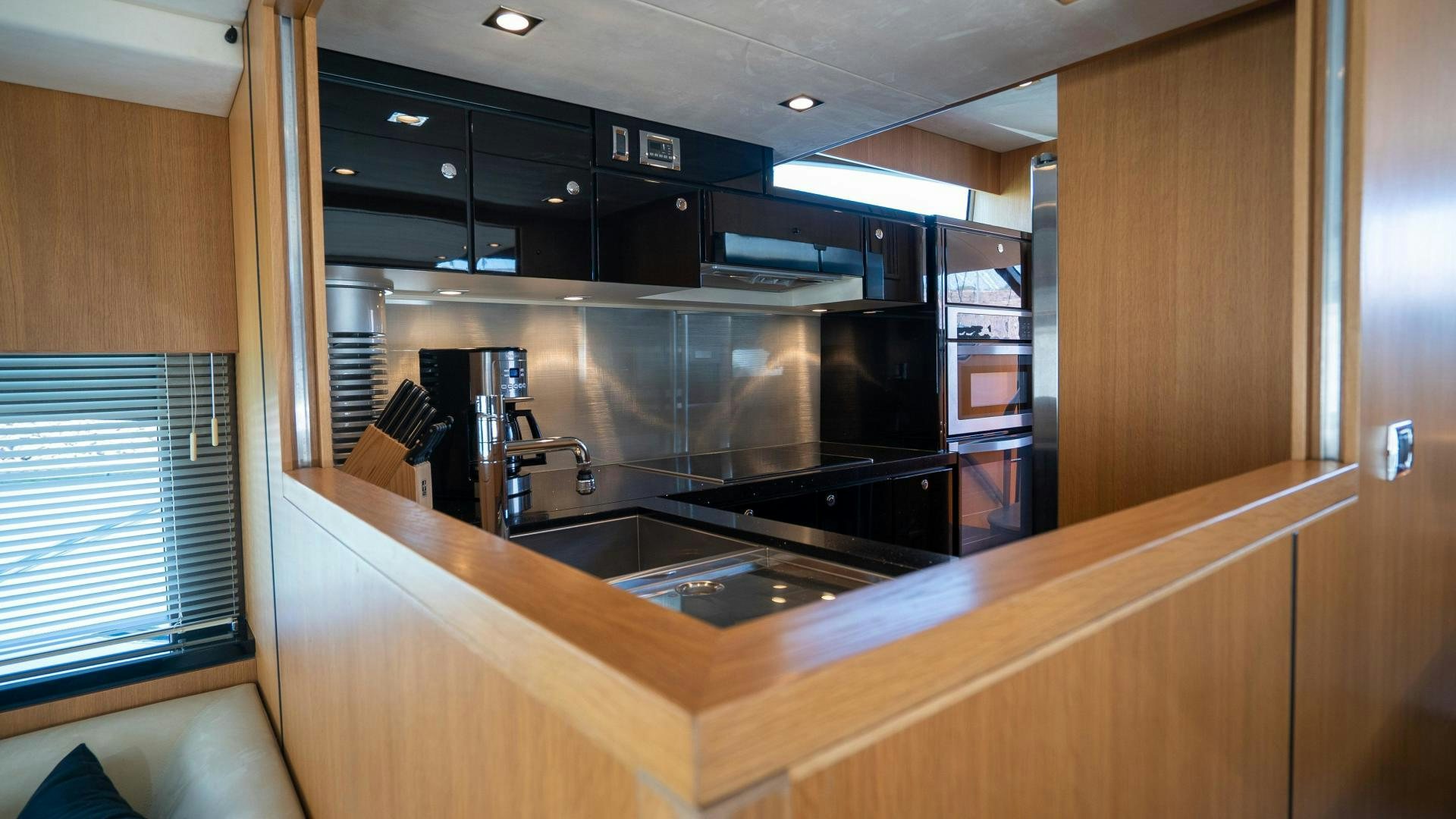 a kitchen with a sink and cabinets aboard OCHO UNO Yacht for Sale