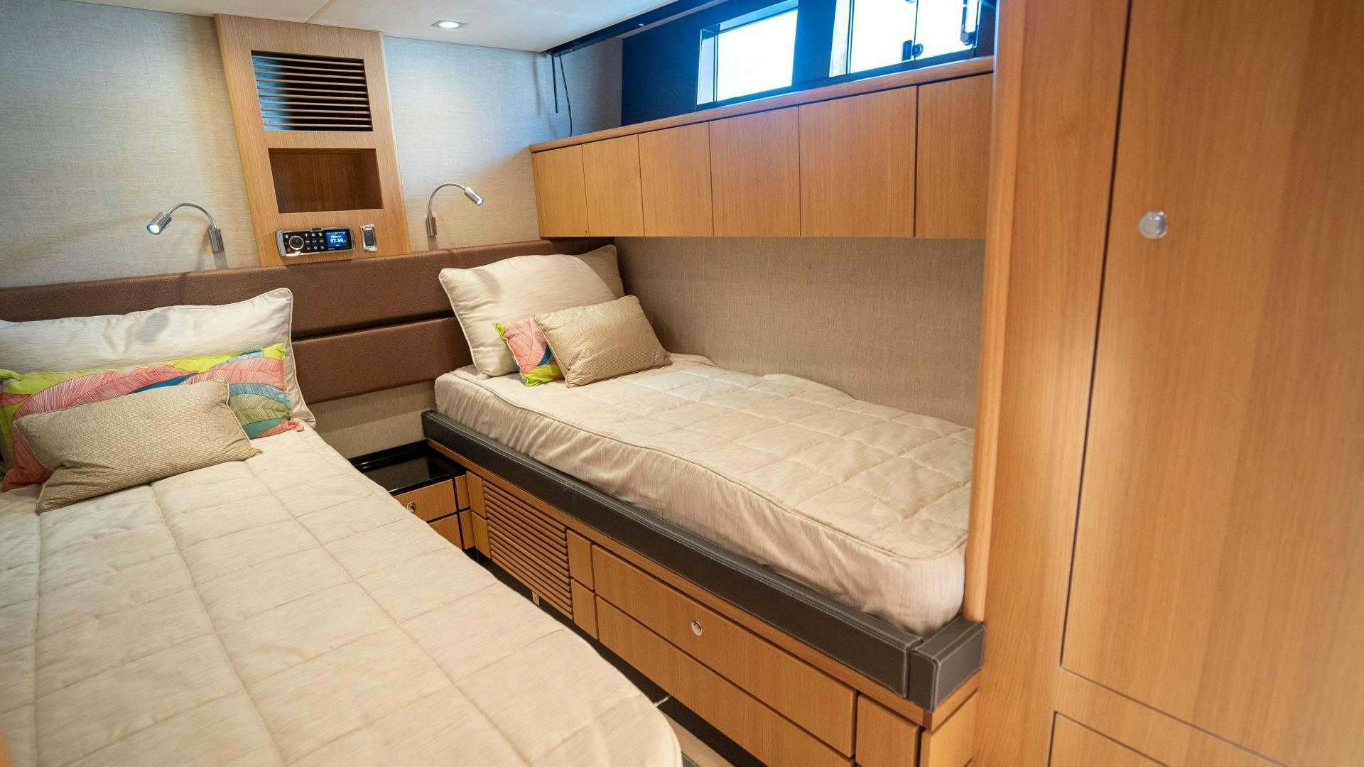 a couple of beds in a room aboard OCHO UNO Yacht for Sale