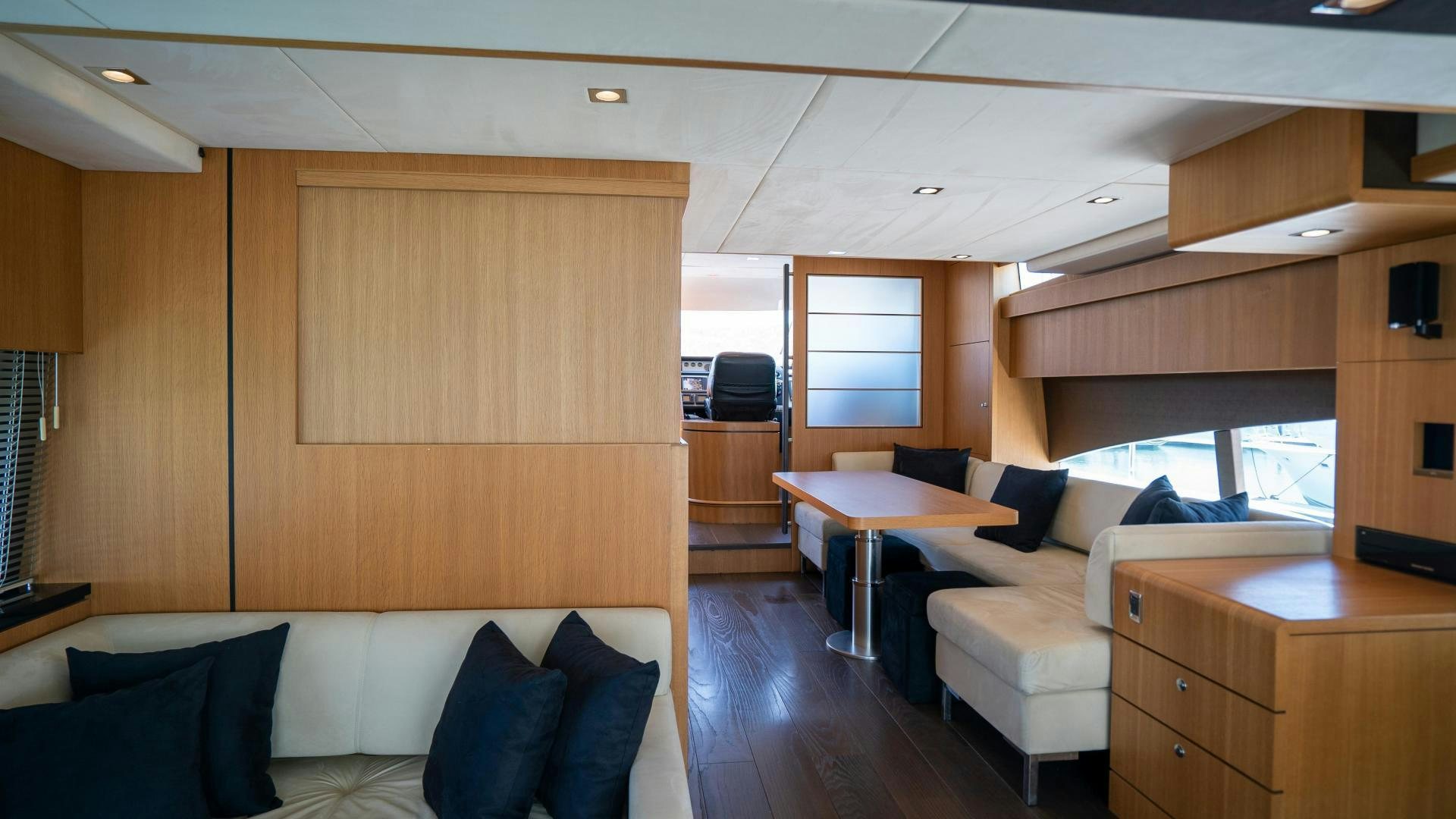 a room with a couch and a television aboard OCHO UNO Yacht for Sale