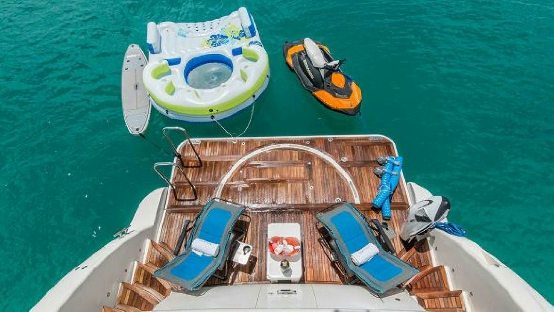 a boat with a person on it aboard NO LIMITS Yacht for Sale