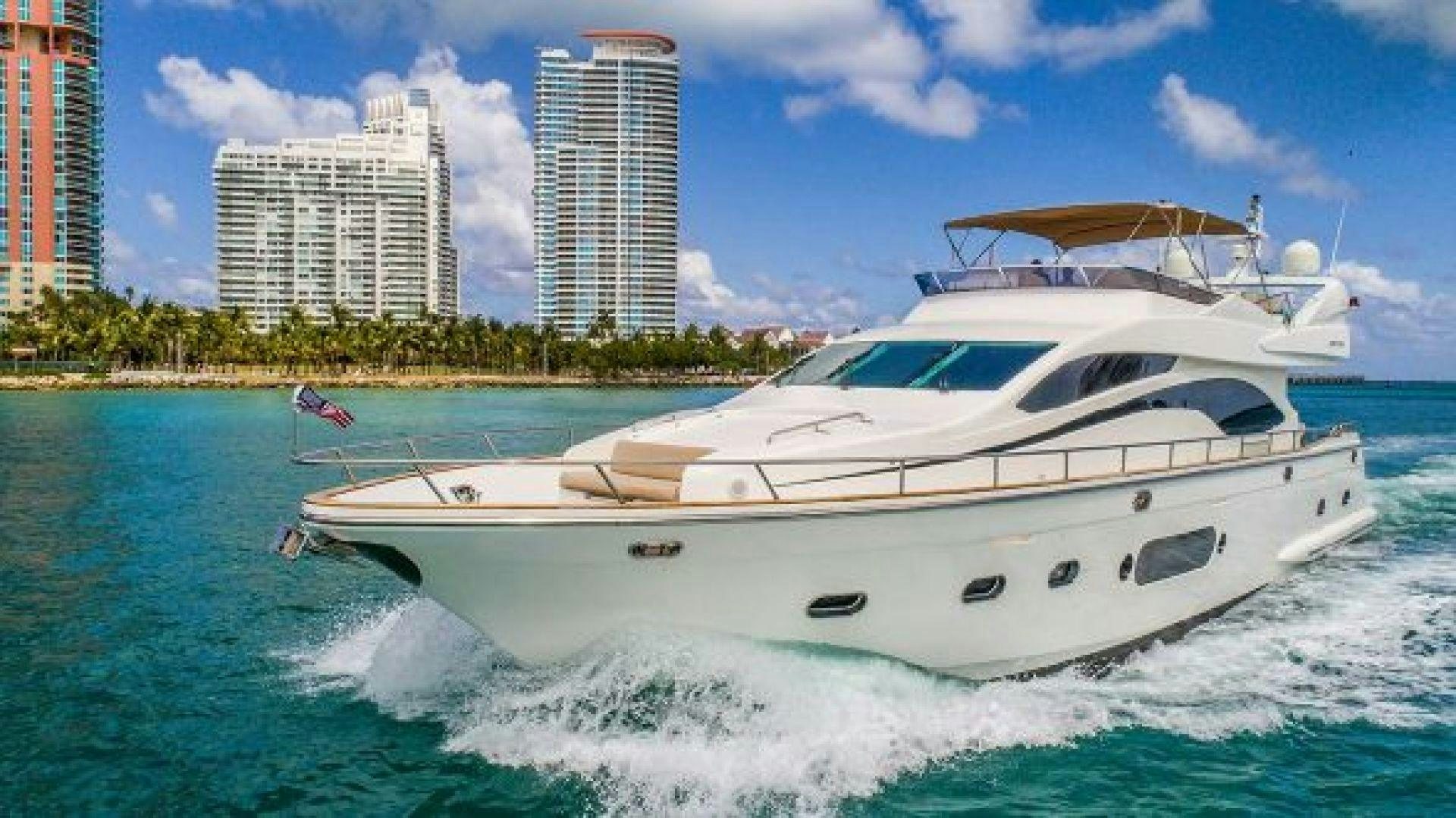 a white yacht on the water aboard NO LIMITS Yacht for Sale