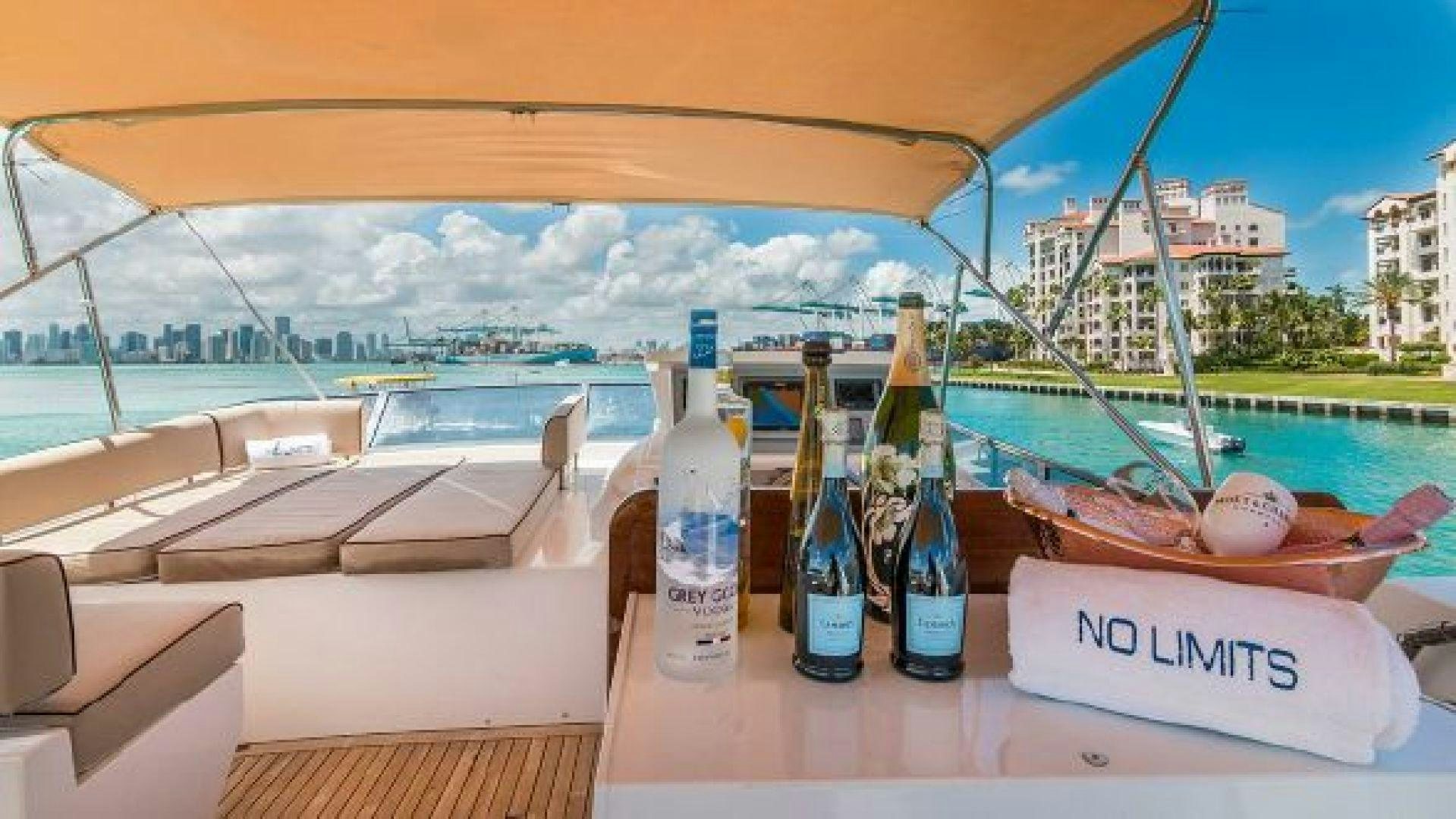 bottles of liquor on a table aboard NO LIMITS Yacht for Sale