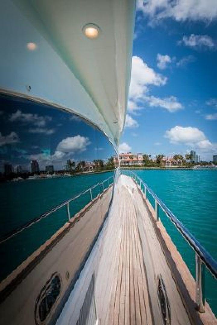 a long dock leading to a city aboard NO LIMITS Yacht for Sale