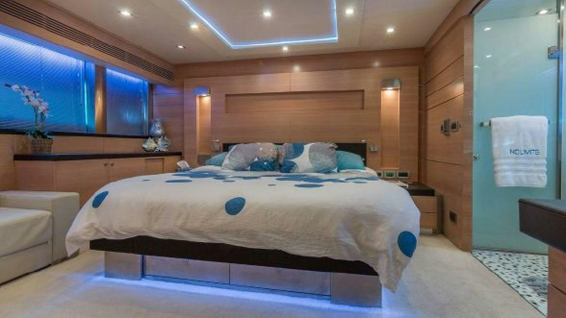 a bed in a room aboard NO LIMITS Yacht for Sale