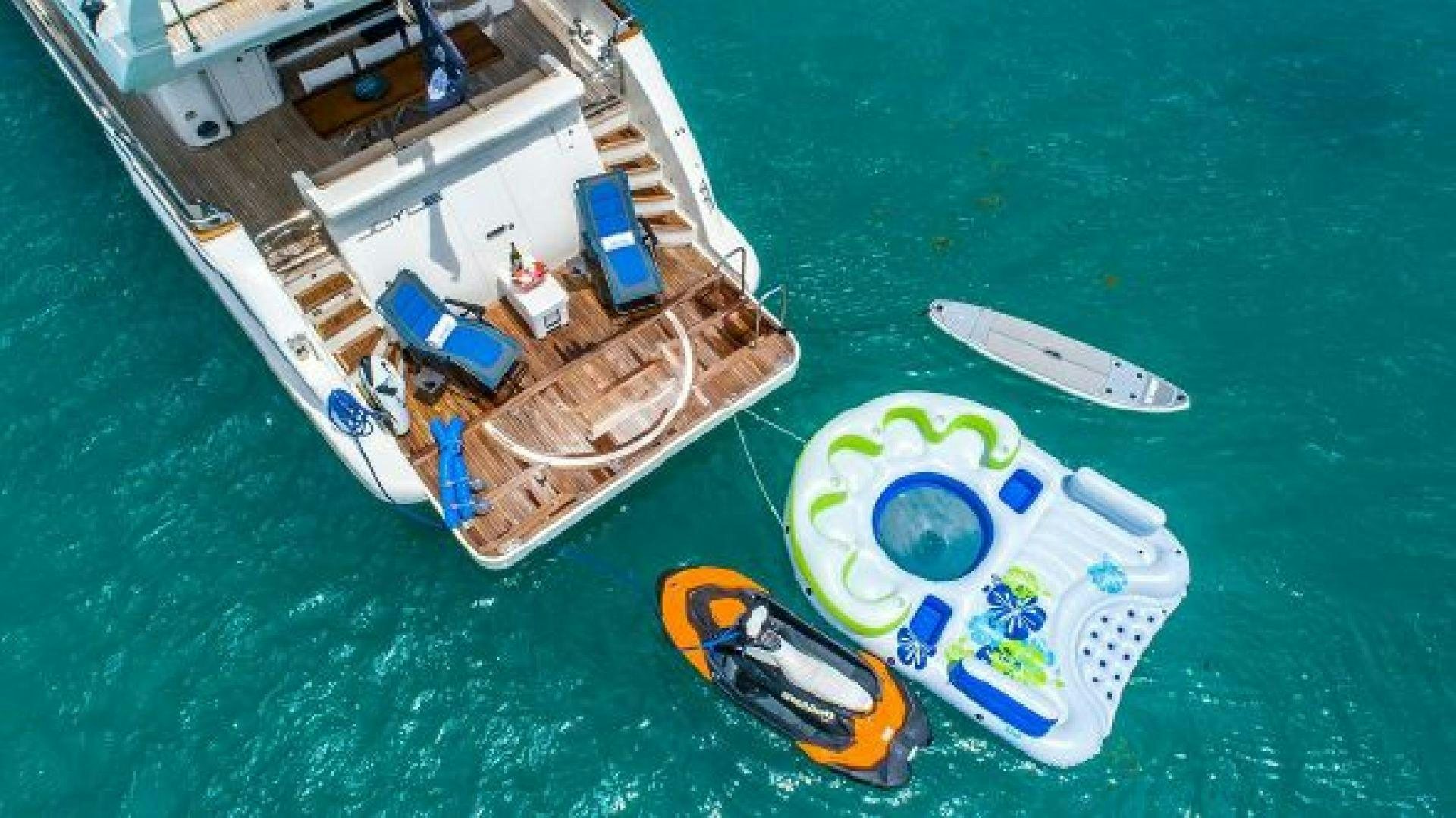 a boat with a paddle on the water aboard NO LIMITS Yacht for Sale