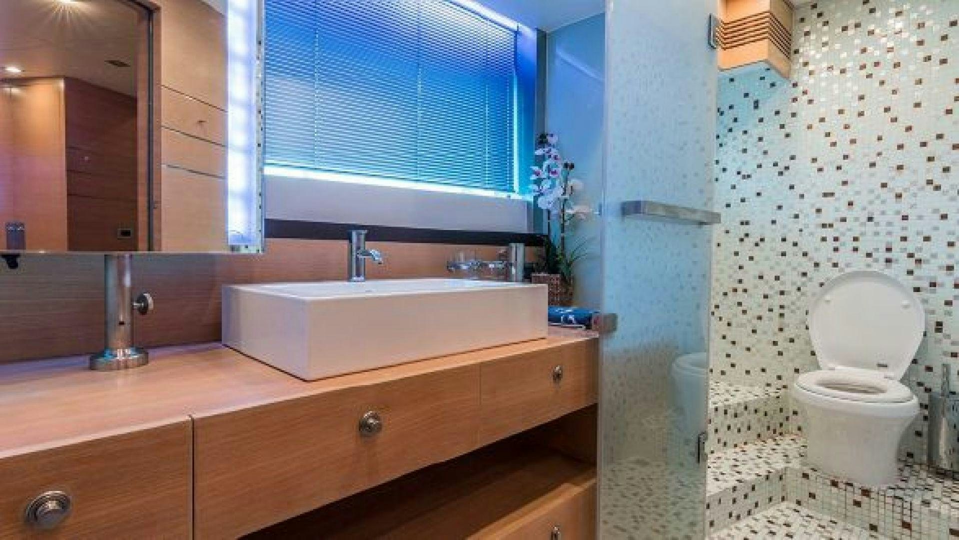 a bathroom with a sink toilet and a bathtub aboard NO LIMITS Yacht for Sale
