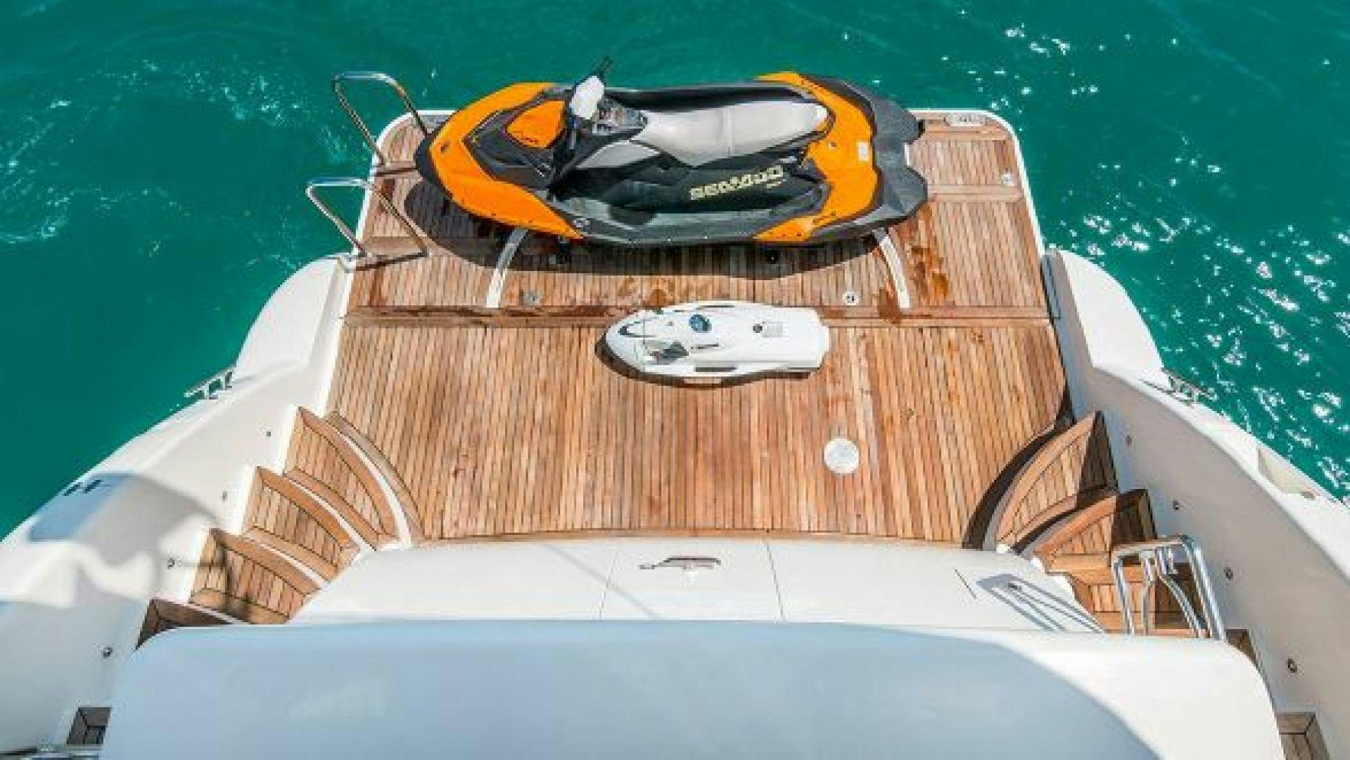 a boat with a helmet on the front aboard NO LIMITS Yacht for Sale