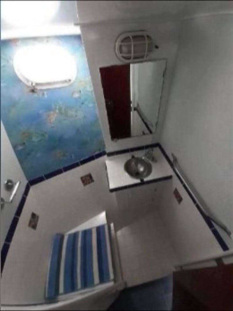 a small kitchen with a small sink aboard FANTASEA Yacht for Sale