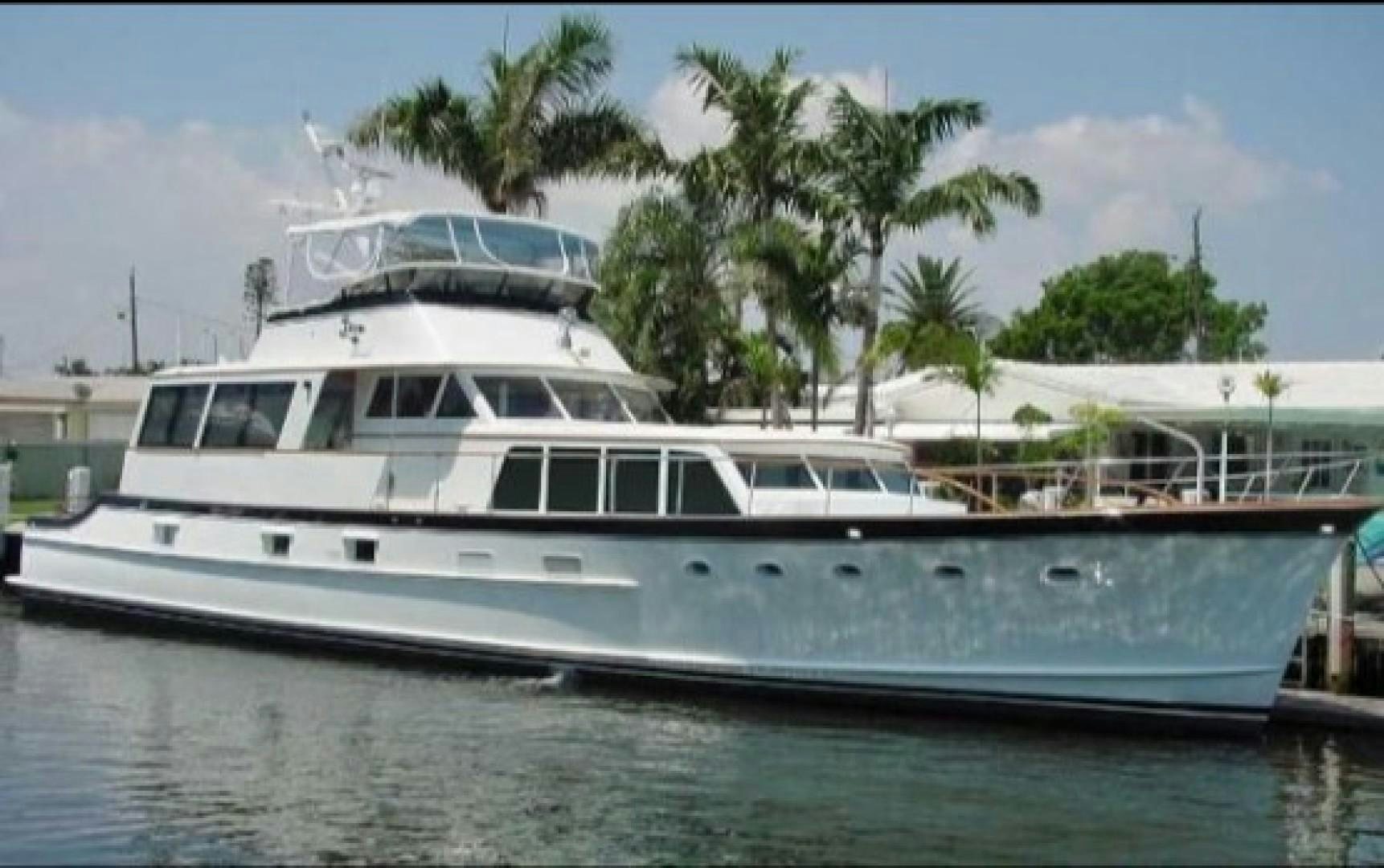 a white yacht docked aboard FANTASEA Yacht for Sale