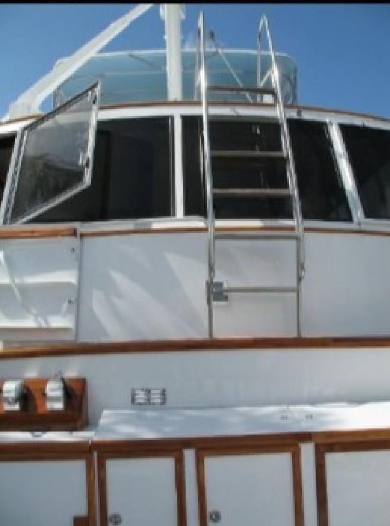 a white building with a ladder aboard FANTASEA Yacht for Sale
