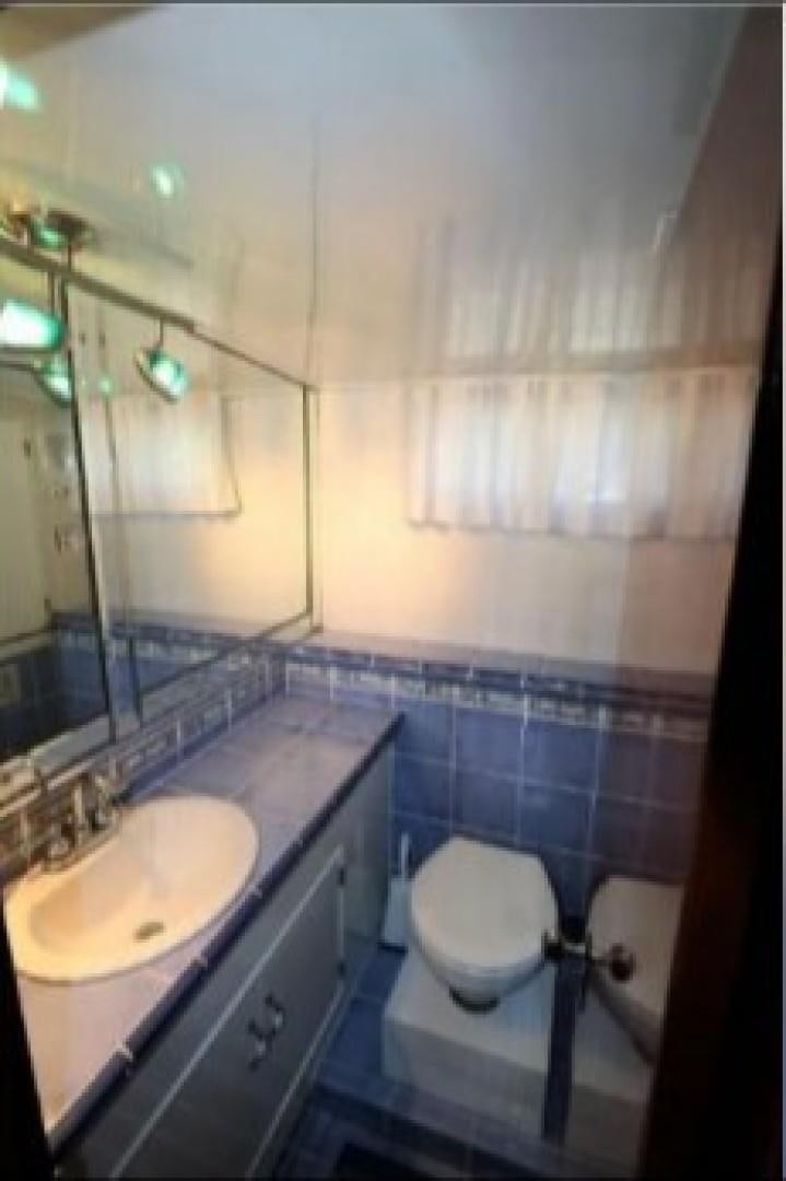 a bathroom with a toilet and sink aboard FANTASEA Yacht for Sale