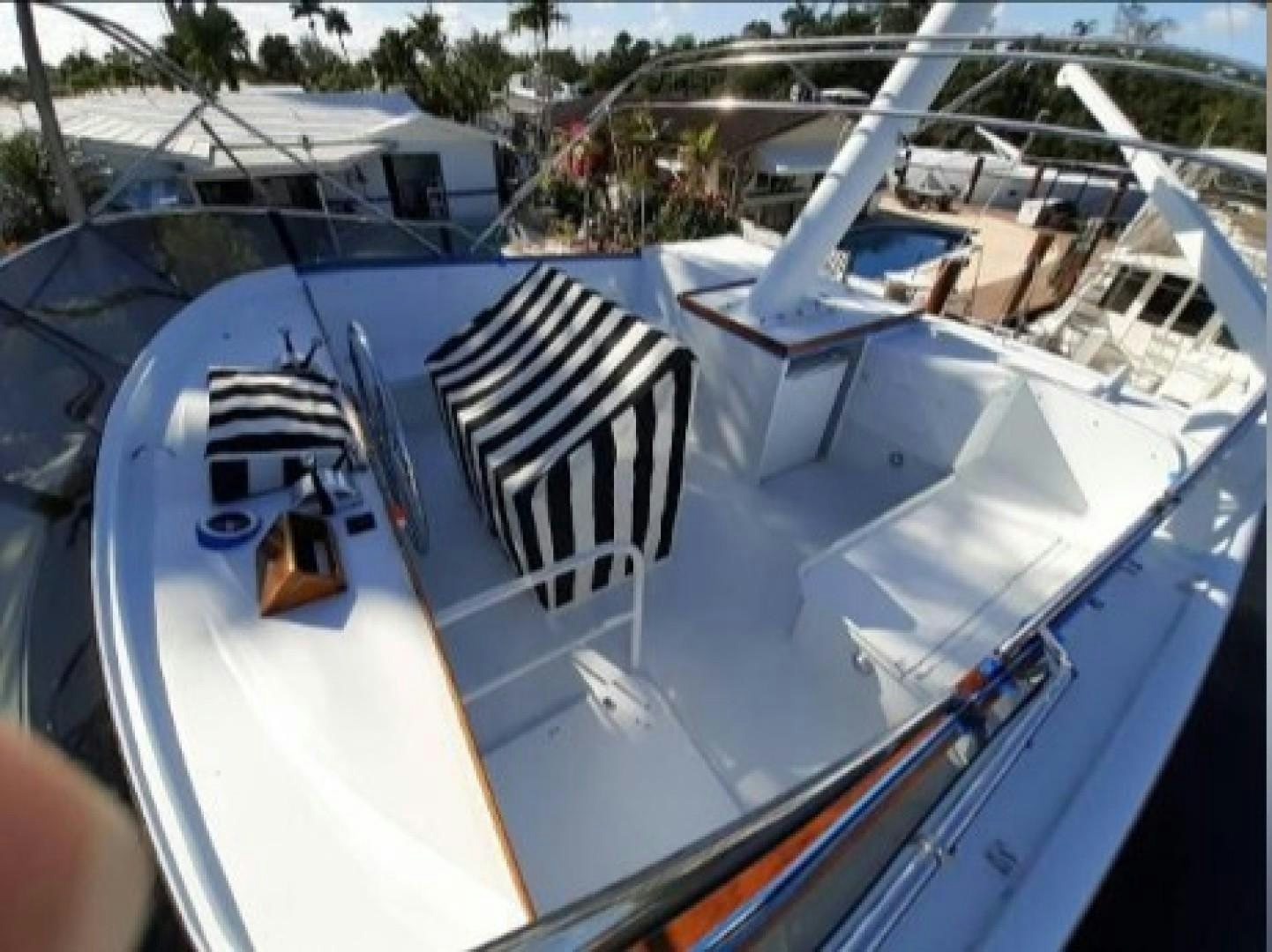 a boat with a black and white stripe aboard FANTASEA Yacht for Sale
