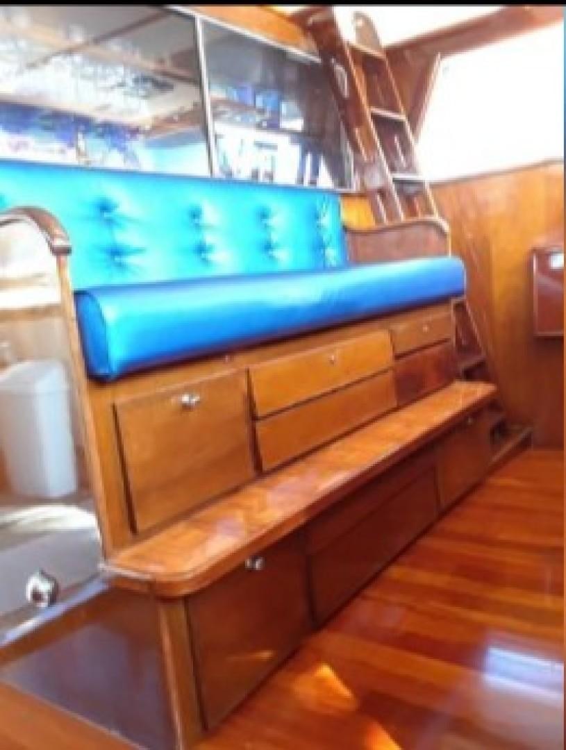 a wooden cabinet with drawers aboard FANTASEA Yacht for Sale