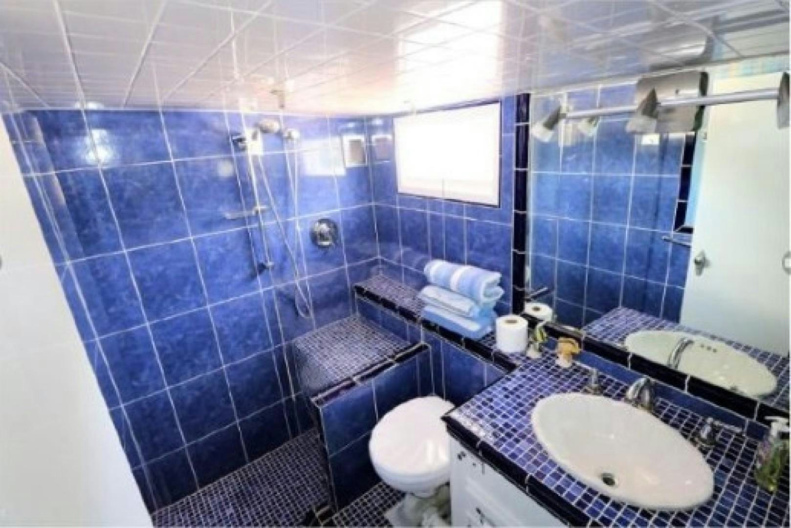 a bathroom with a sink and a toilet aboard FANTASEA Yacht for Sale