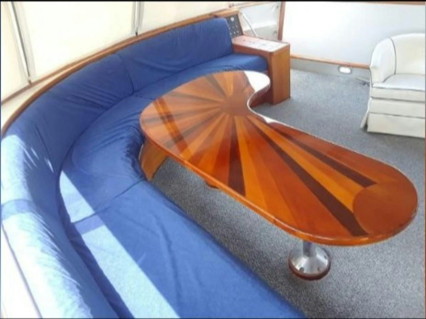 a wooden skateboard on a bed aboard FANTASEA Yacht for Sale