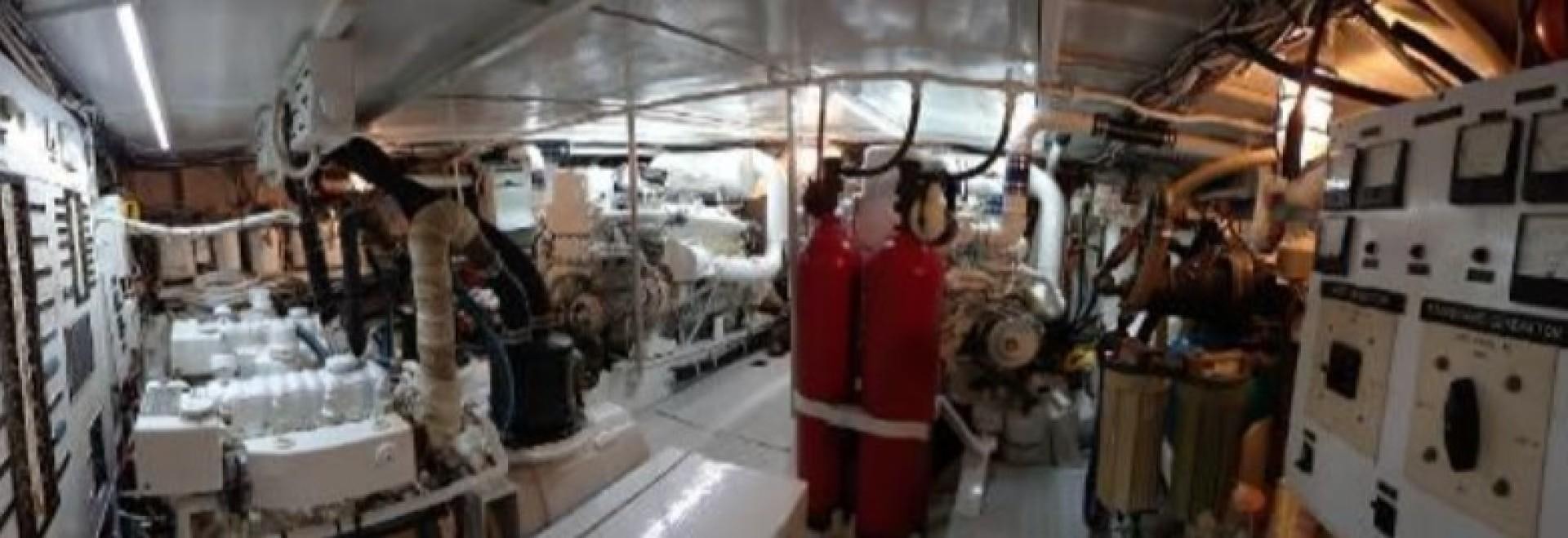 a person in a red coat in a factory aboard FANTASEA Yacht for Sale