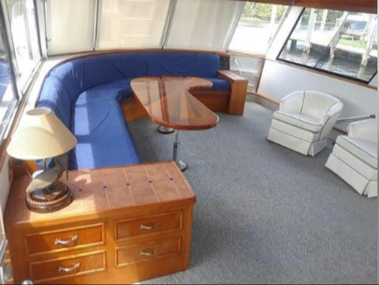 a room with a desk and a chair aboard FANTASEA Yacht for Sale