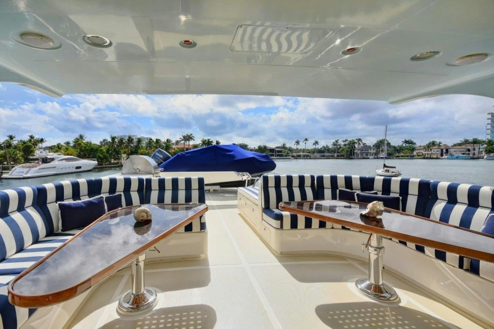 a room with a view of a city and water aboard INEVITABLE Yacht for Sale