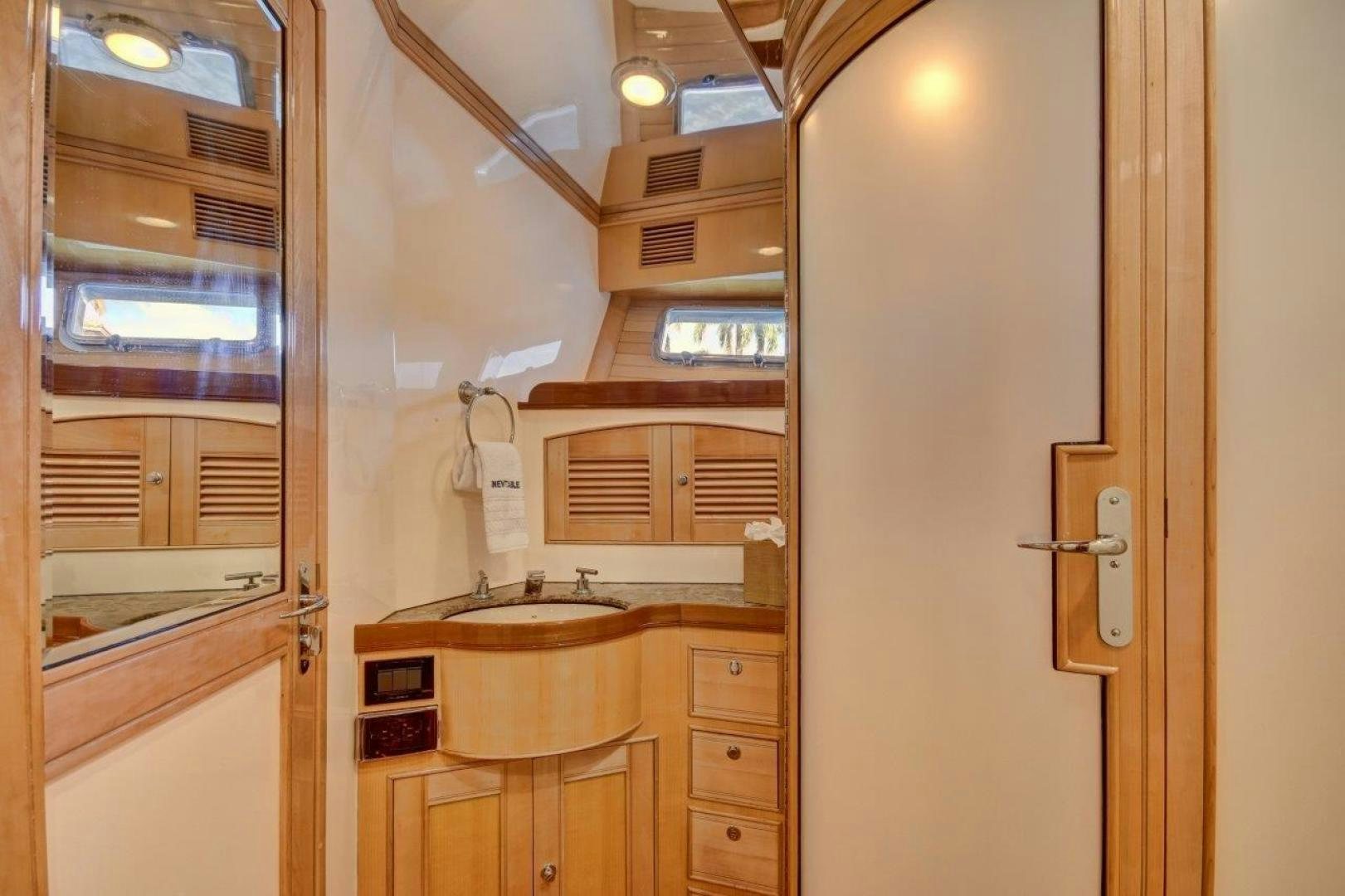 a room with a sink and a door aboard INEVITABLE Yacht for Sale