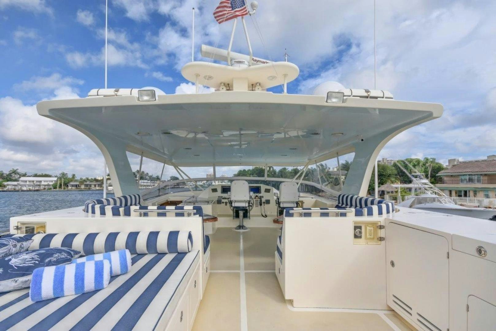 a large ship with a flag on the deck aboard INEVITABLE Yacht for Sale