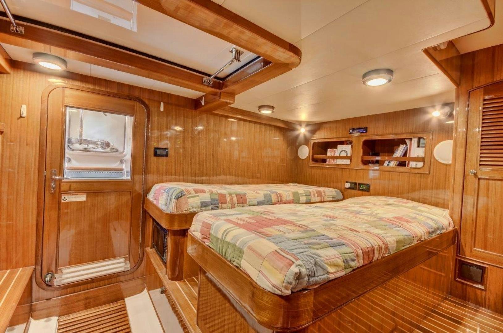 a bedroom with a bed aboard INEVITABLE Yacht for Sale