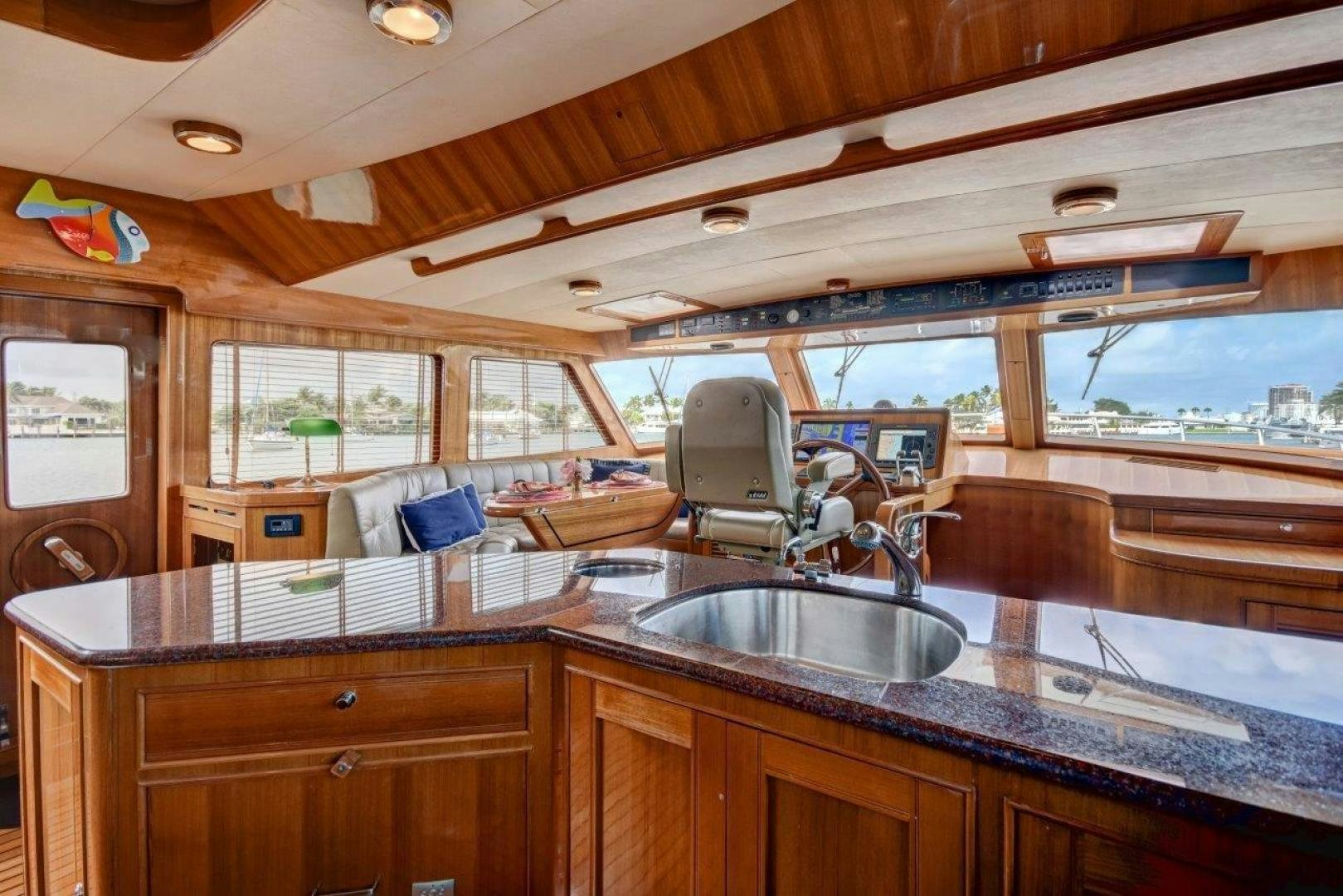 a kitchen with a sink and cabinets aboard INEVITABLE Yacht for Sale