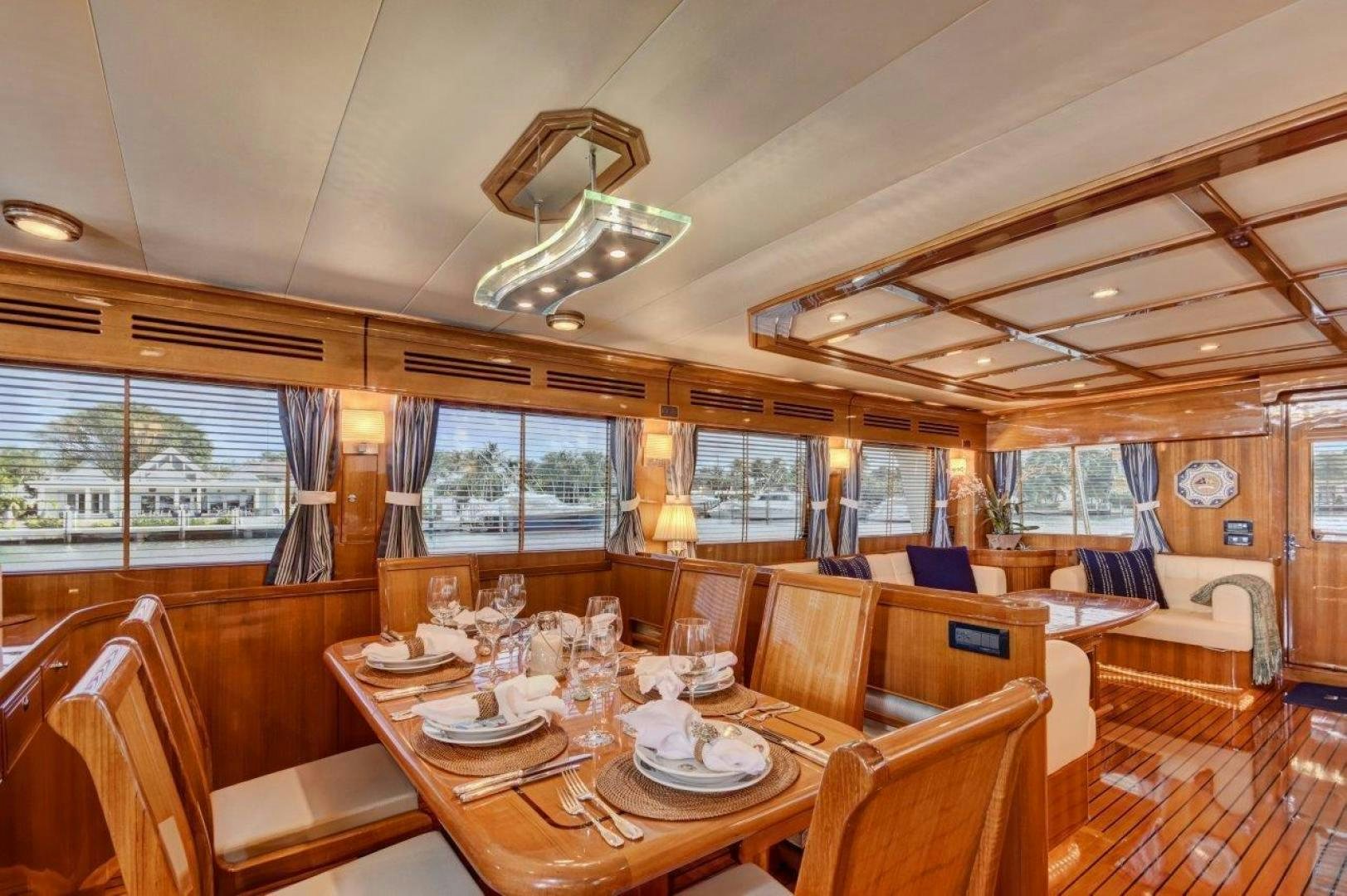 a dining room with a large table aboard INEVITABLE Yacht for Sale