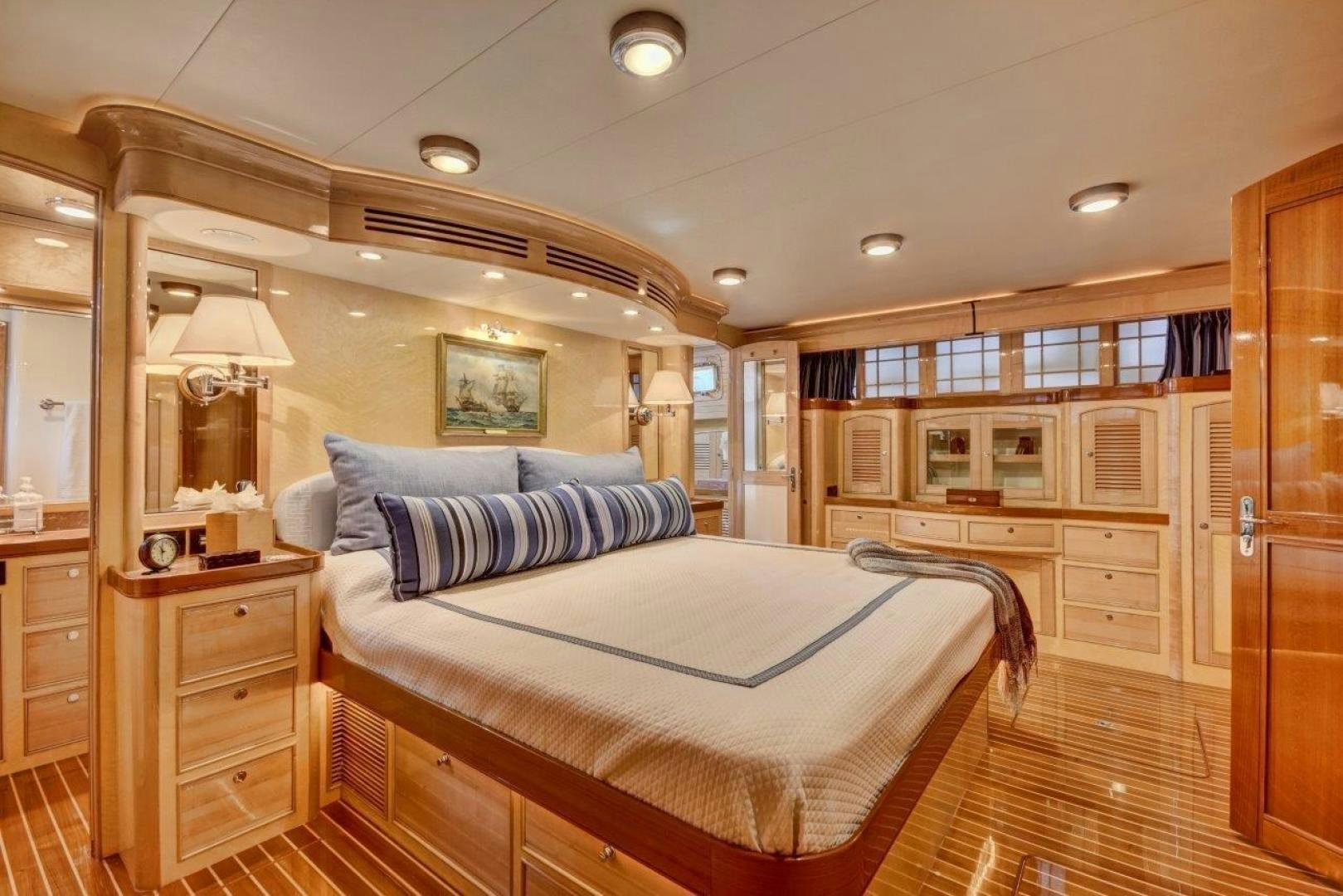a large bedroom with a large bed aboard INEVITABLE Yacht for Sale
