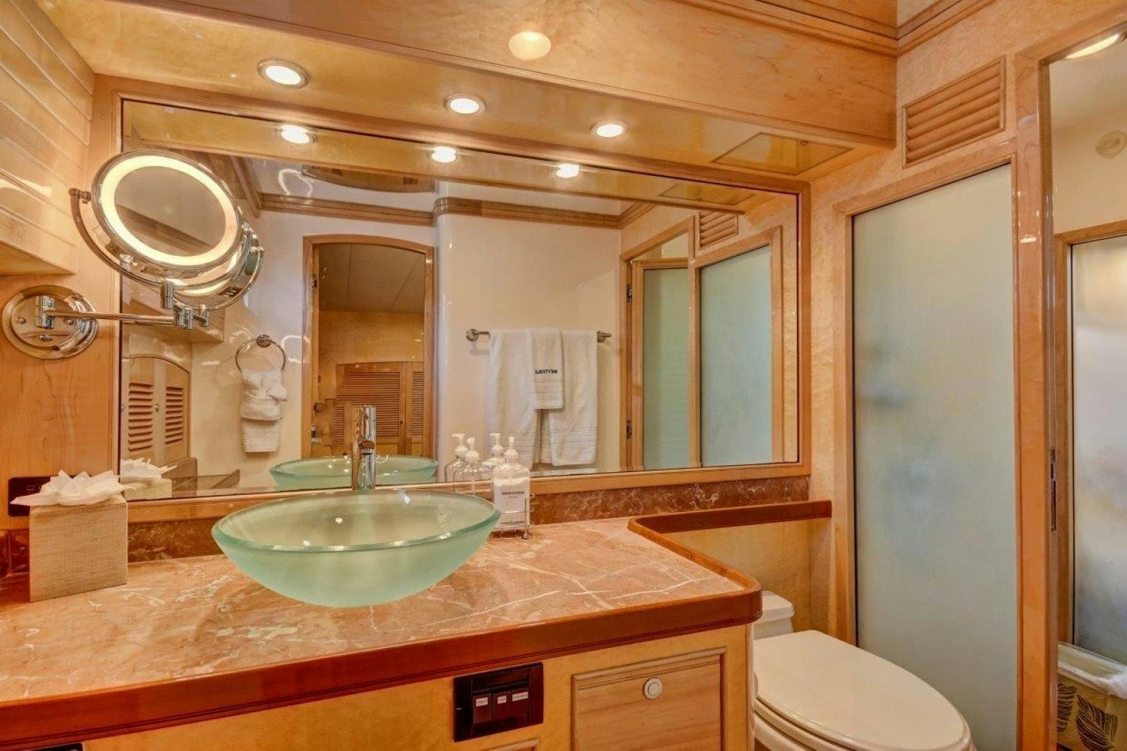 a bathroom with a sink and a mirror aboard INEVITABLE Yacht for Sale