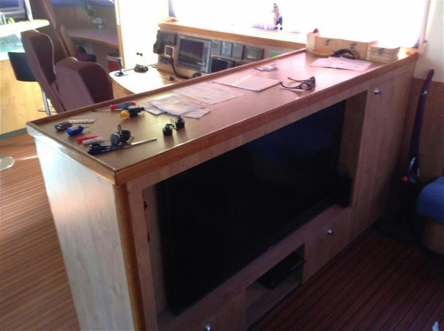 a table with a few objects on it aboard HELICAT RED Yacht for Sale