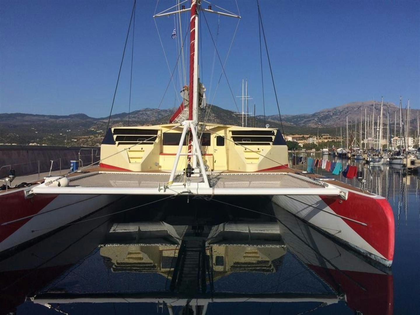 a boat docked at a pier aboard HELICAT RED Yacht for Sale