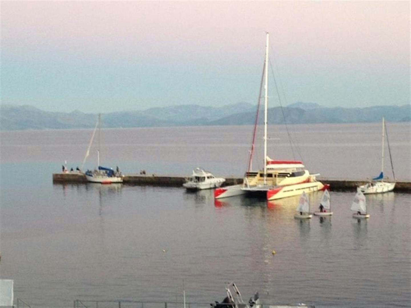 a group of boats in a harbor aboard HELICAT RED Yacht for Sale