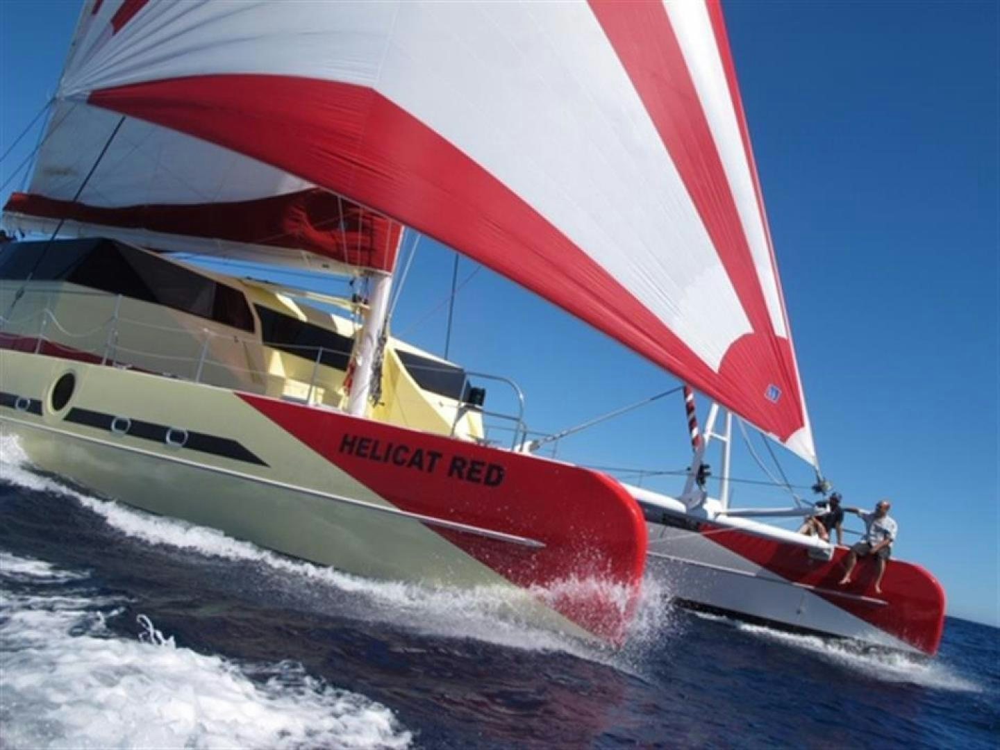 a boat on the water aboard HELICAT RED Yacht for Sale