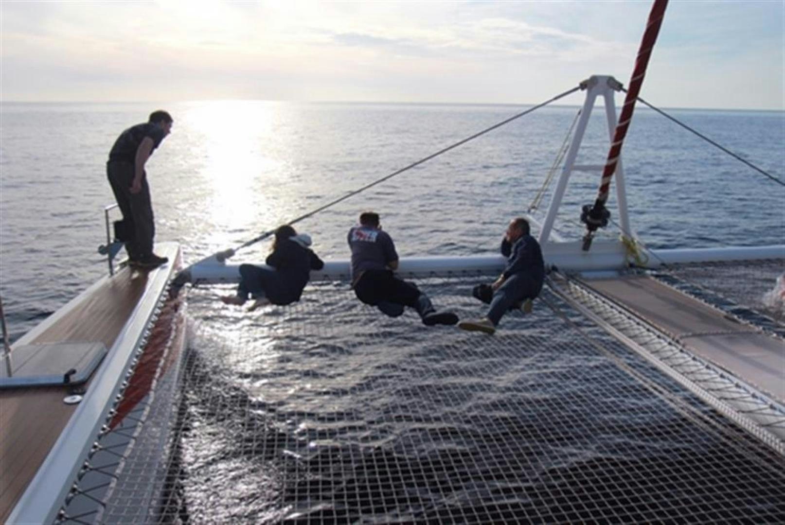 a group of people on a boat aboard HELICAT RED Yacht for Sale