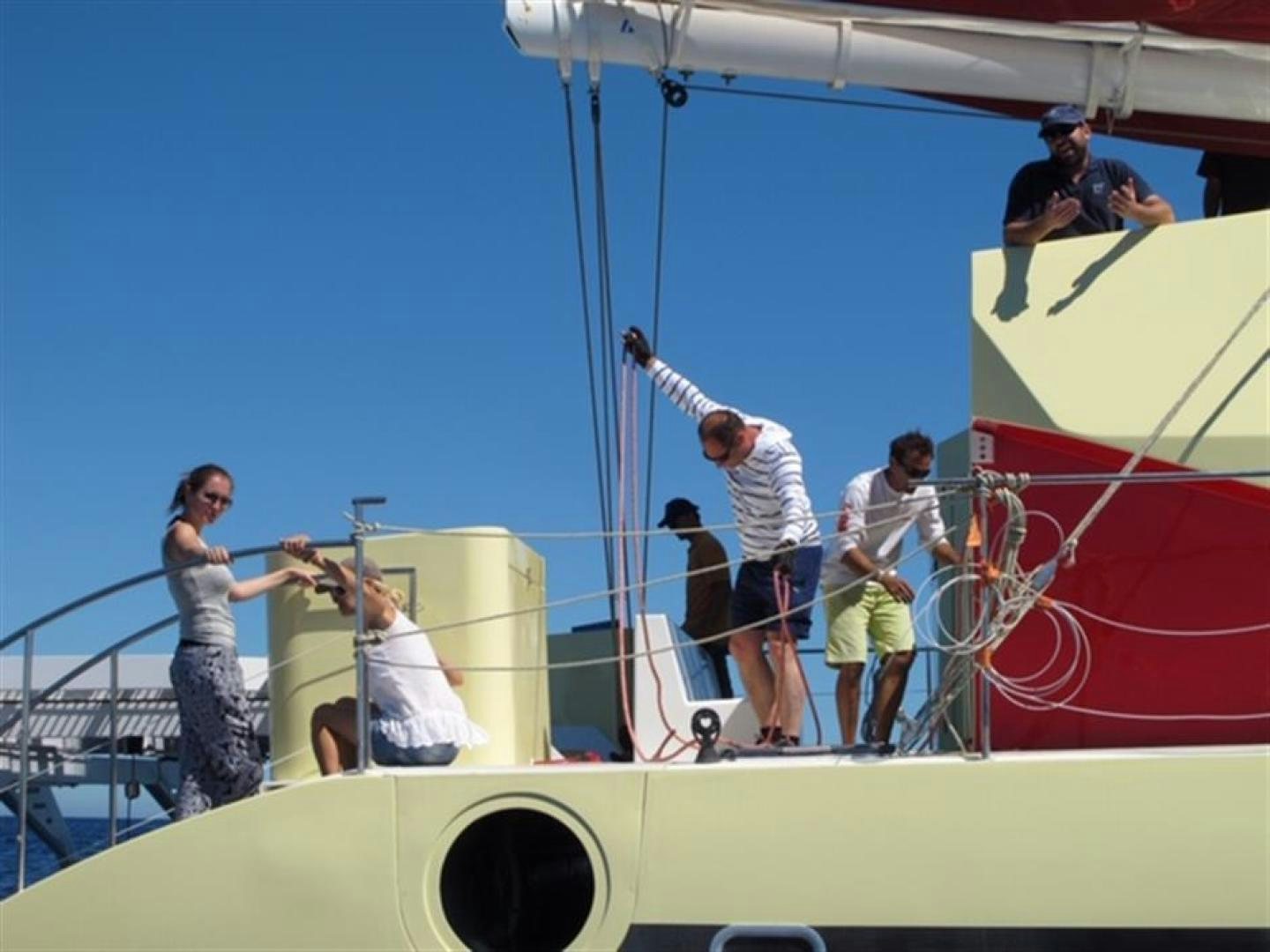 a group of people on a boat aboard HELICAT RED Yacht for Sale