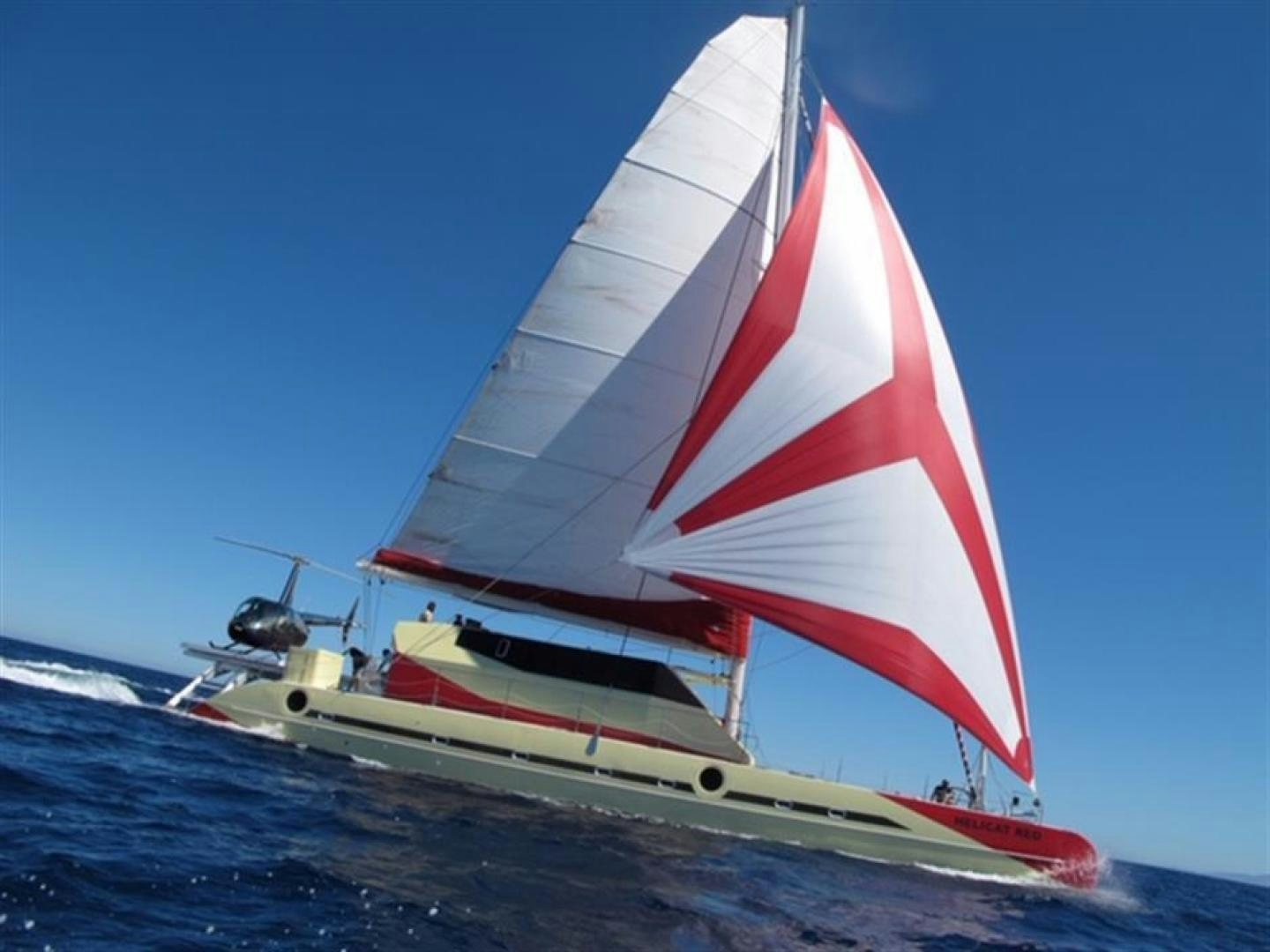 a sailboat on the water aboard HELICAT RED Yacht for Sale
