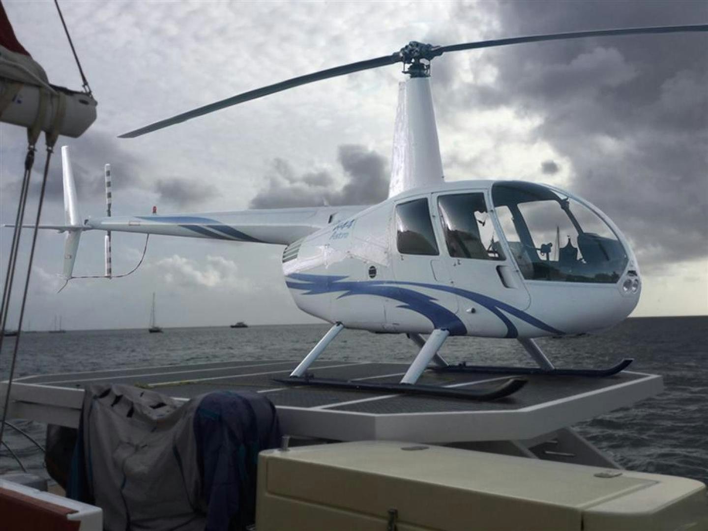 a helicopter on a deck aboard HELICAT RED Yacht for Sale